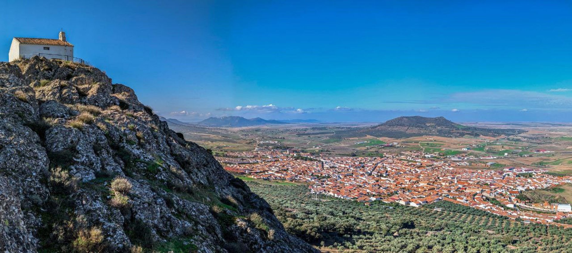 woman wearing yellow long-sleeved dress under white clouds and blue sky during daytime