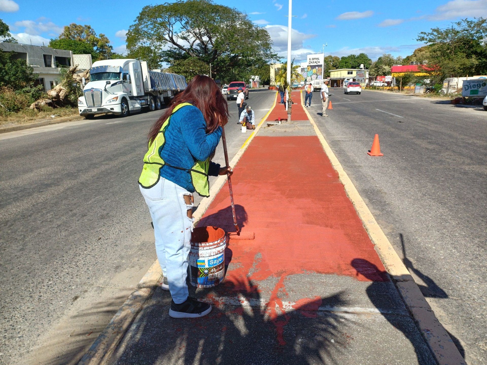 orange and white excavator on brown ground during daytime