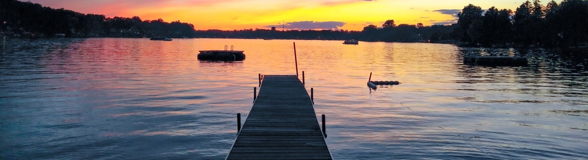blue bridge over river near city buildings during daytime