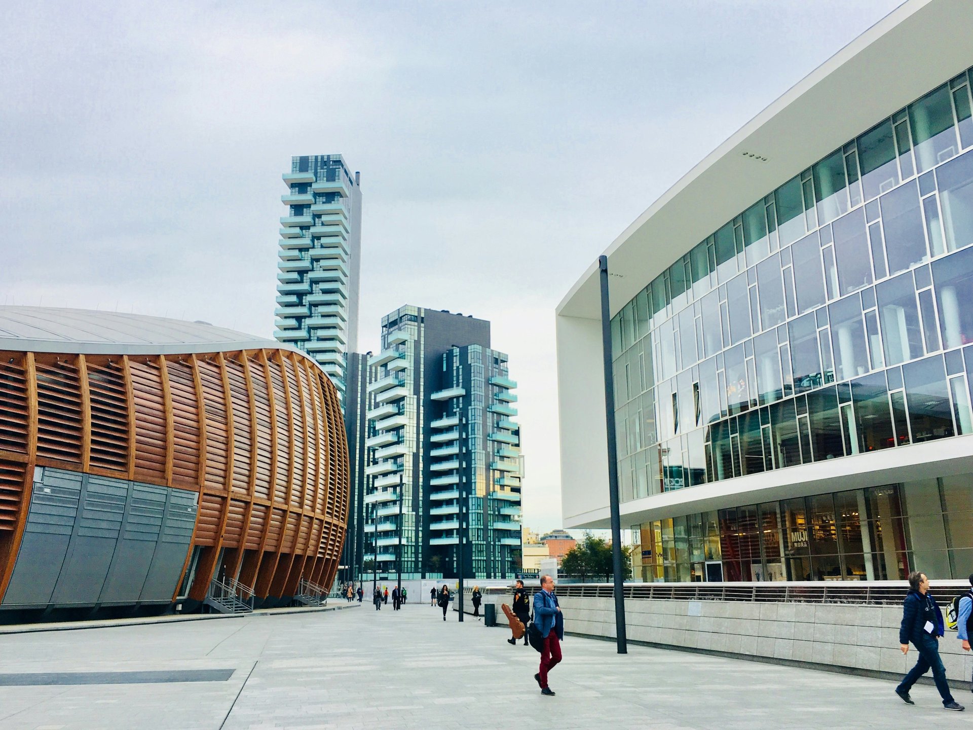 an abstract photo of a curved building with a blue sky in the background
