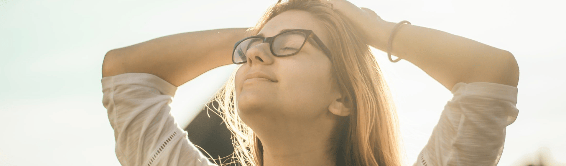woman spreading hair at during sunset