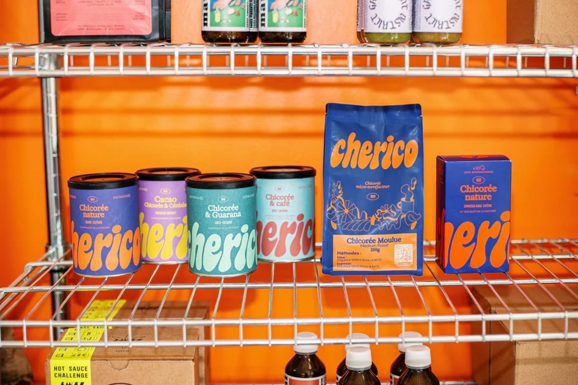 a group of people sitting at tables outside of a restaurant