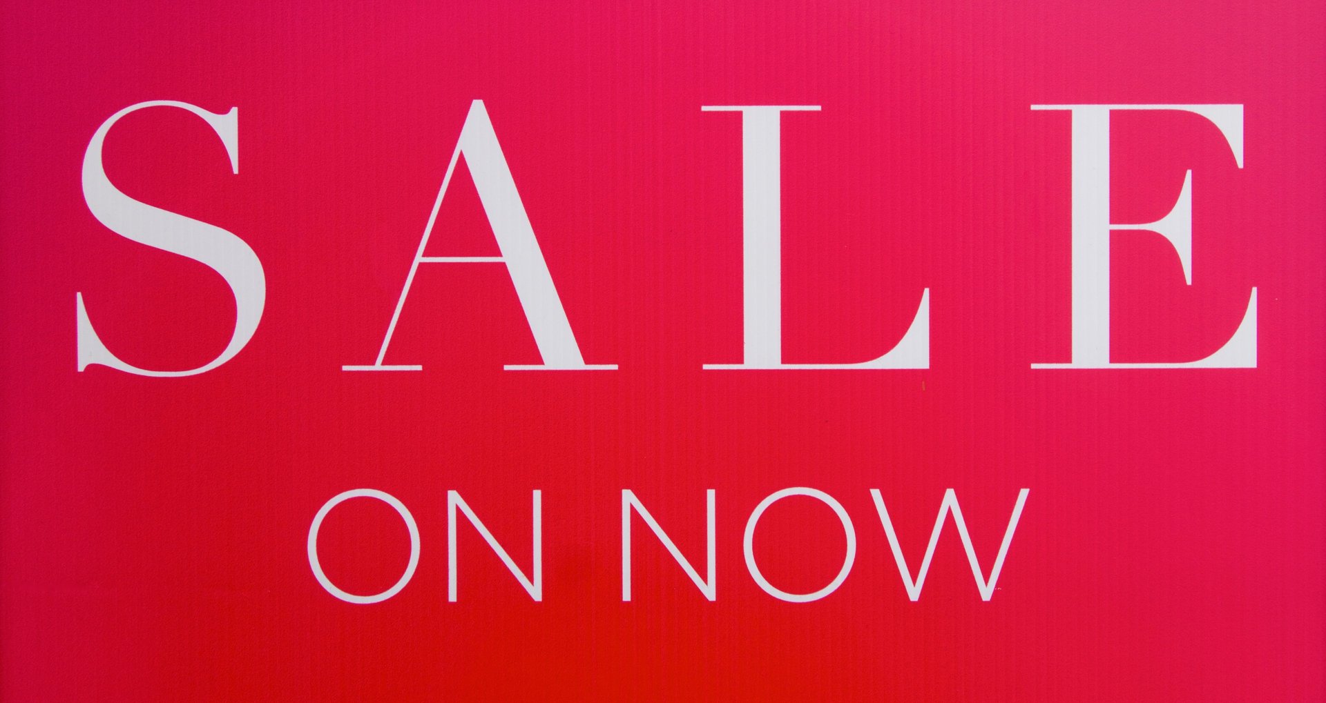 pink pig coin bank on brown wooden table