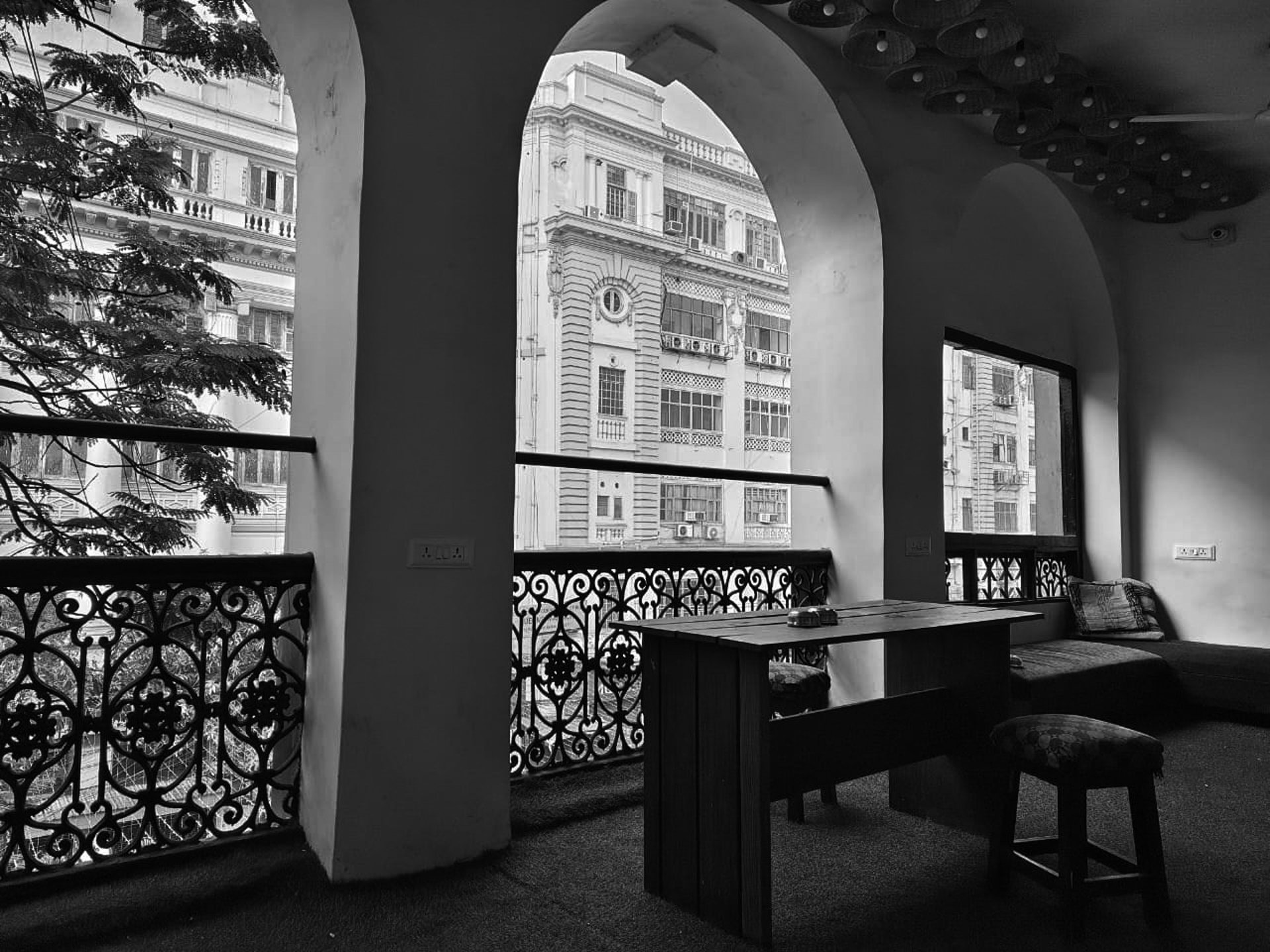 an abstract photo of a curved building with a blue sky in the background