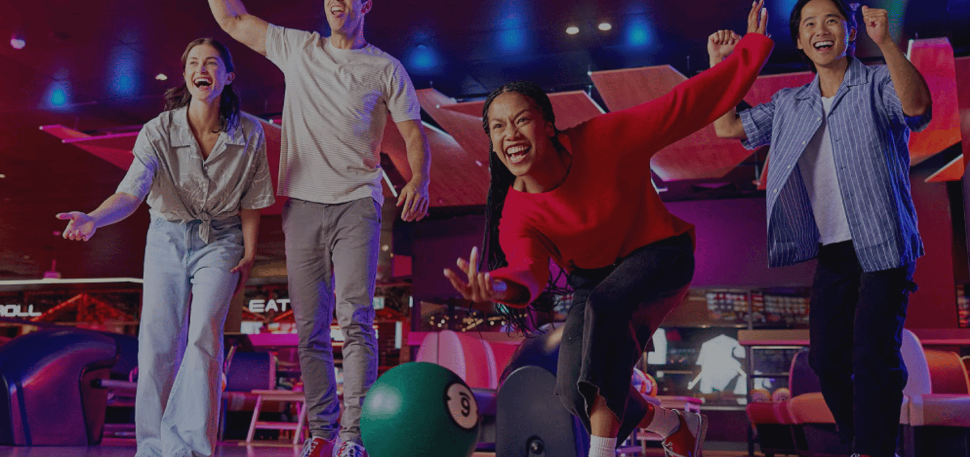 a blurry photo of a person bowling down a bowling alley