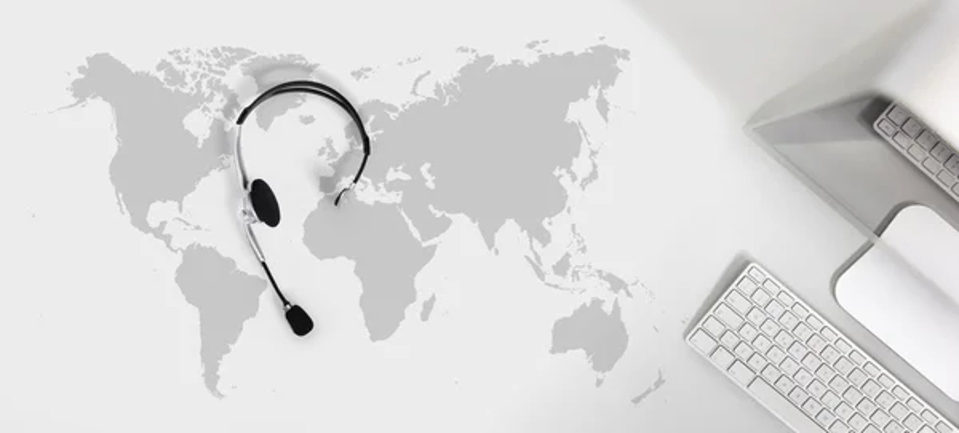 black and brown rotary phone near gray wall