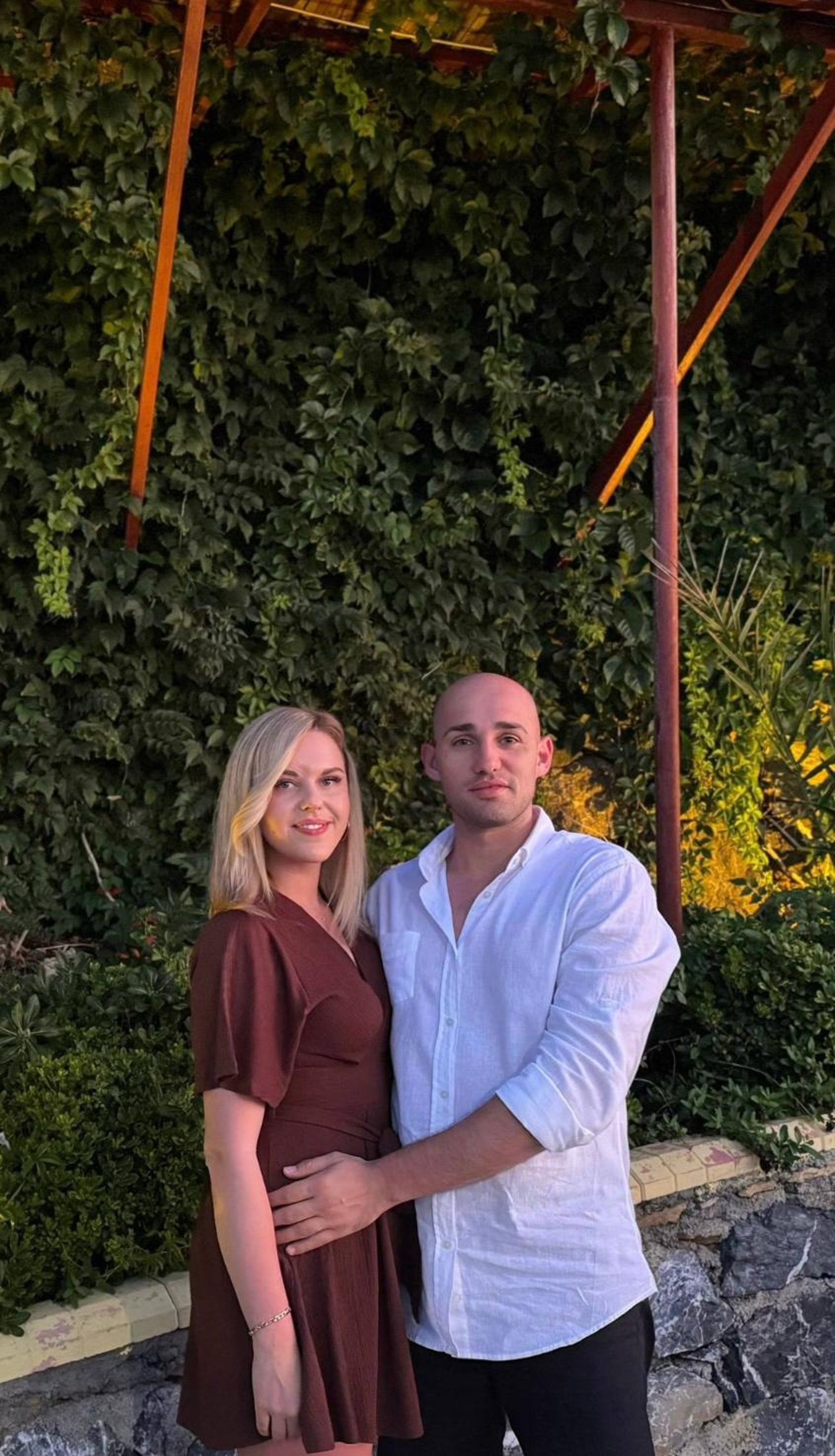 couple wearing silver-colored rings
