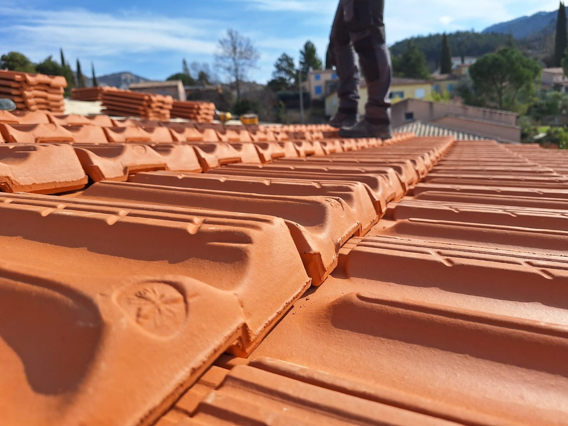 A man on a roof working on a roof