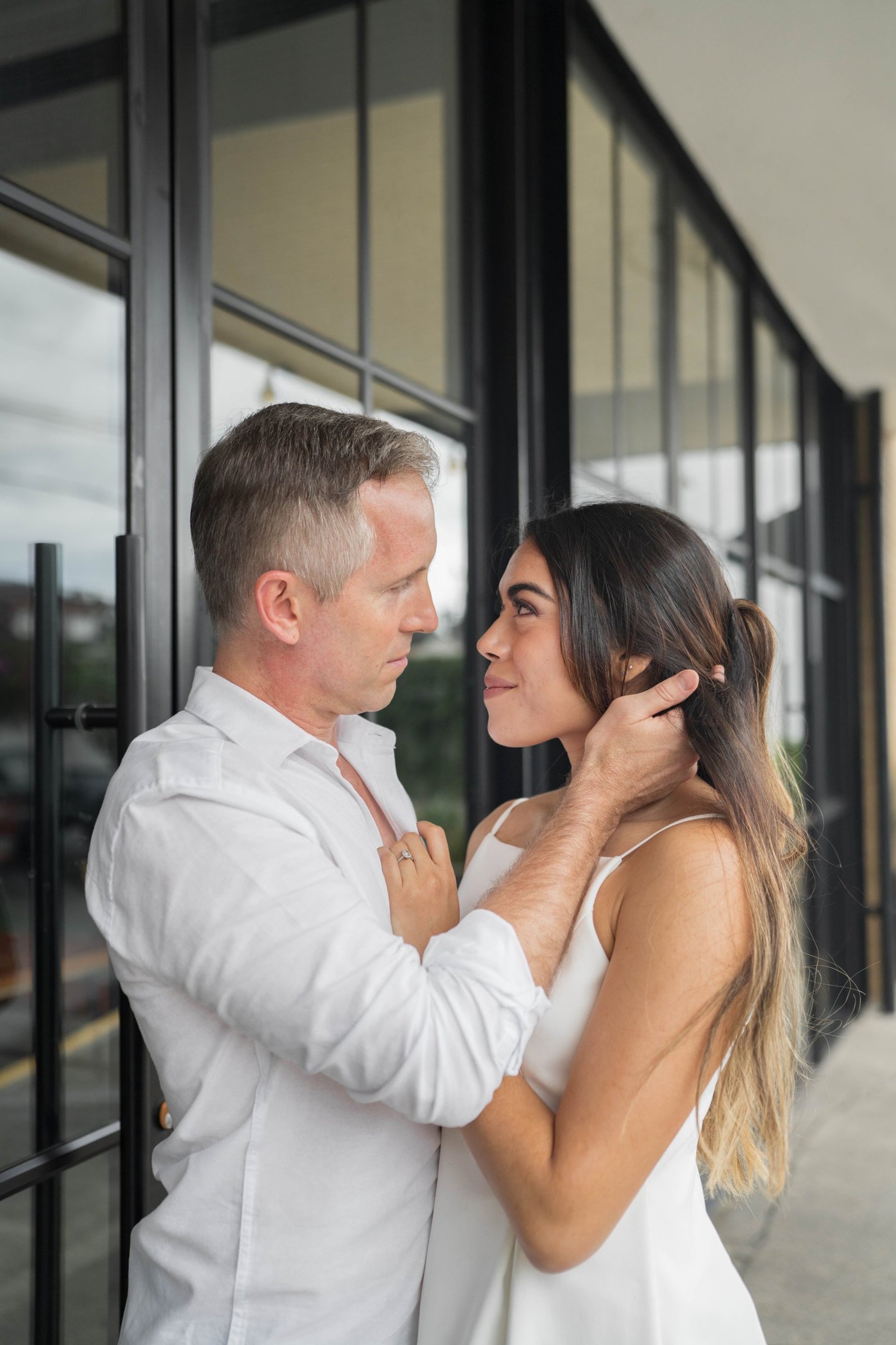 couple wearing silver-colored rings