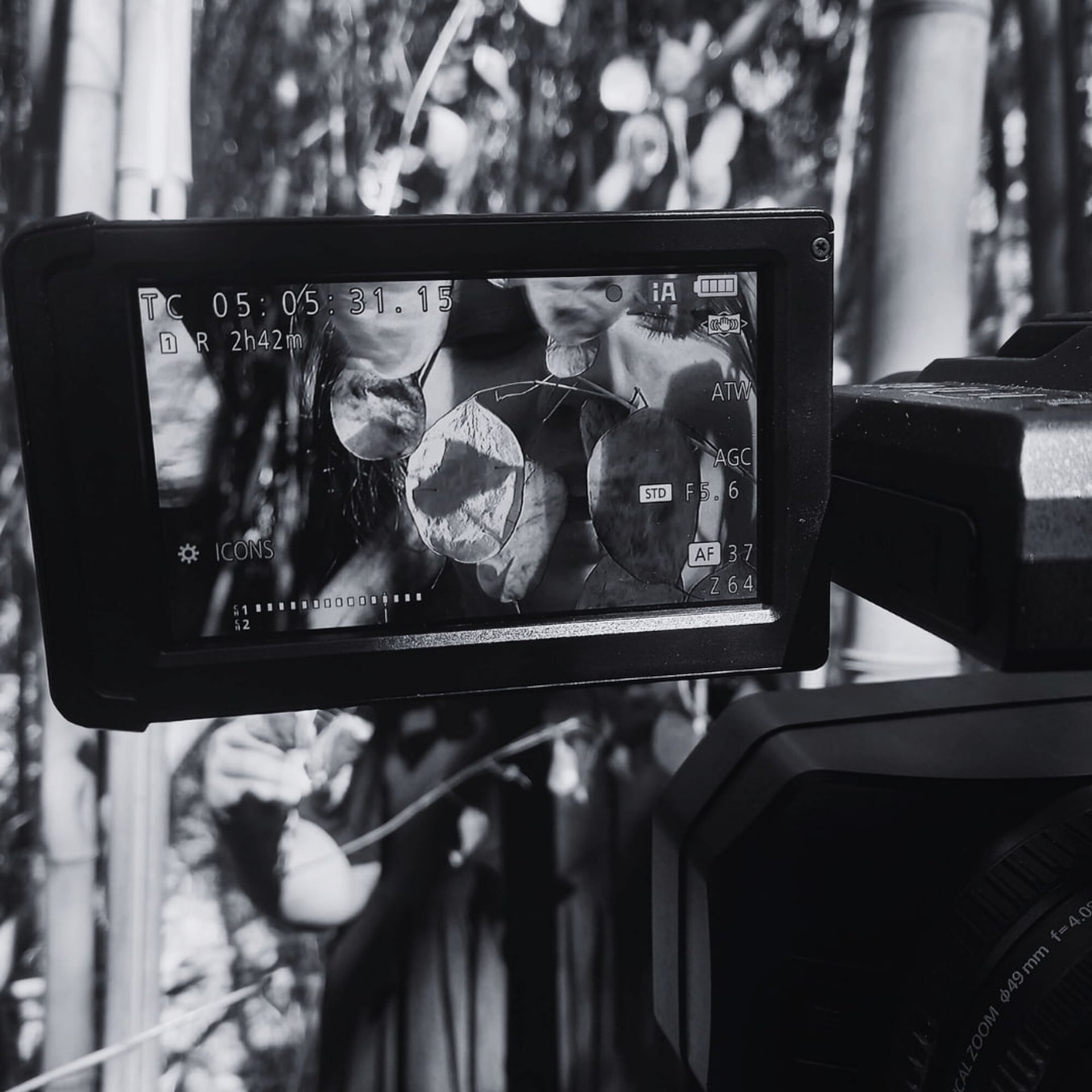 Camera screen showing a face layered with overlapping leaves, part of Tina Bikic’s poetical digital storytelling project in n