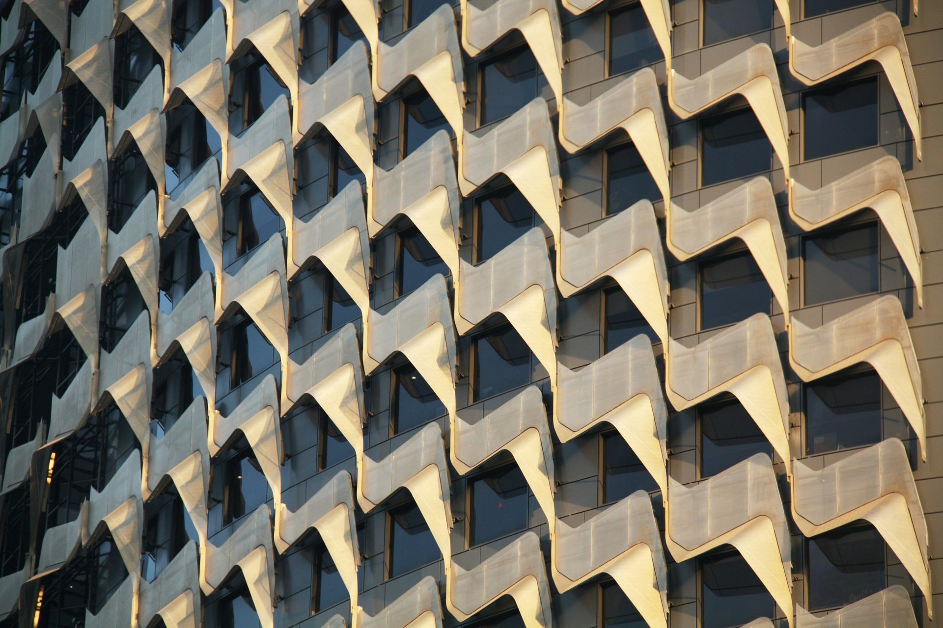 woman wearing yellow long-sleeved dress under white clouds and blue sky during daytime