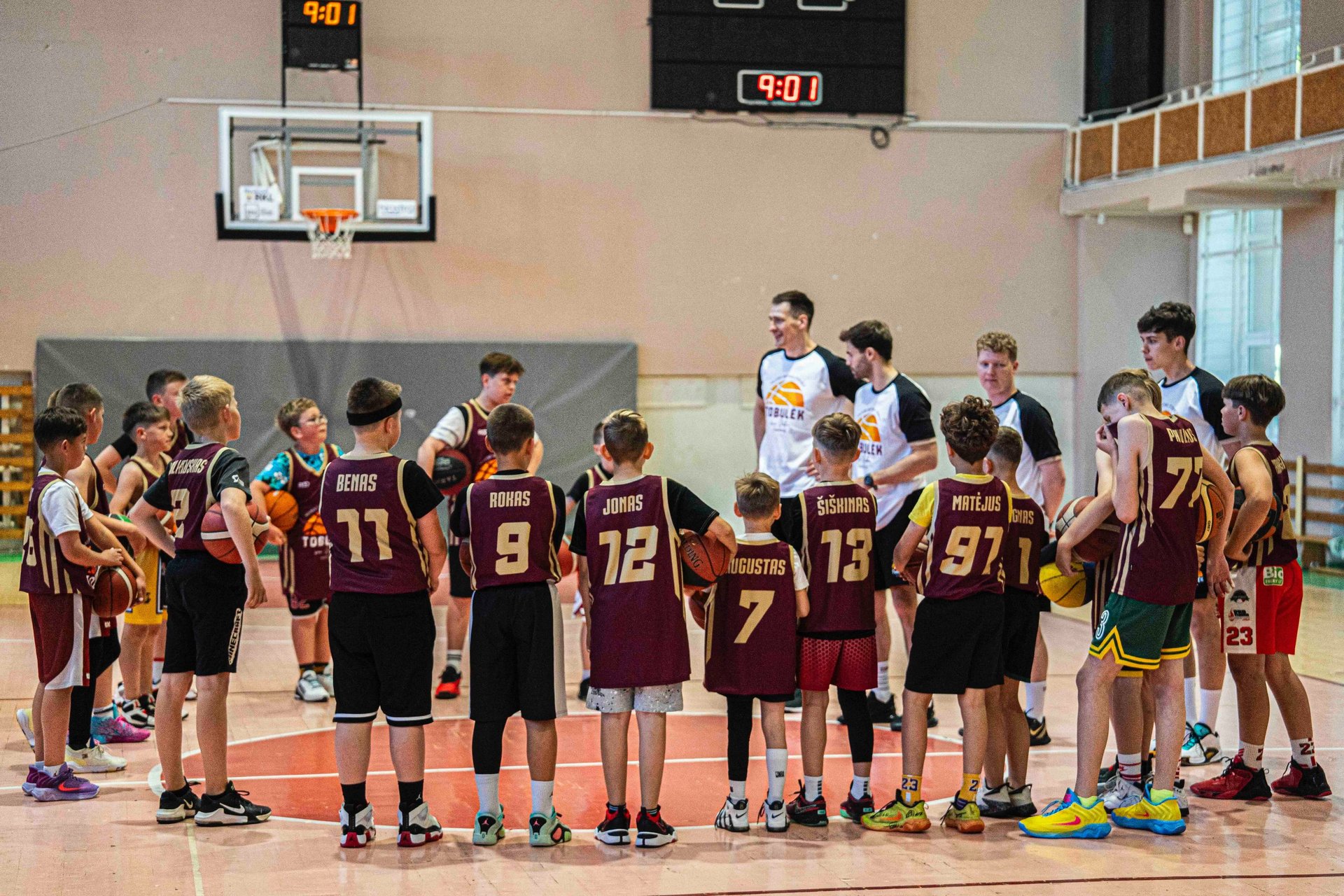 an overhead view of a basketball court with orange markings