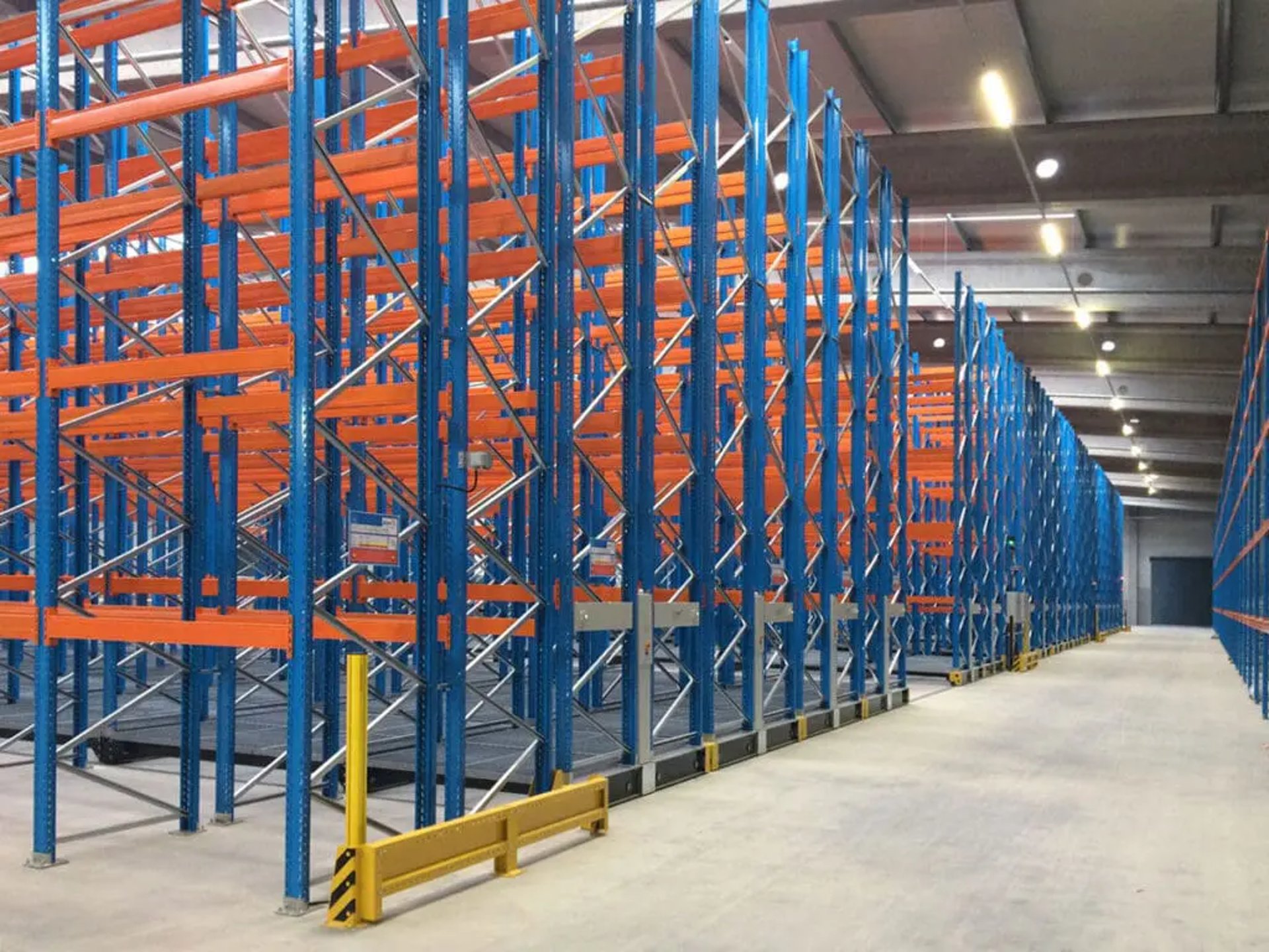 a large room with blue and yellow bars