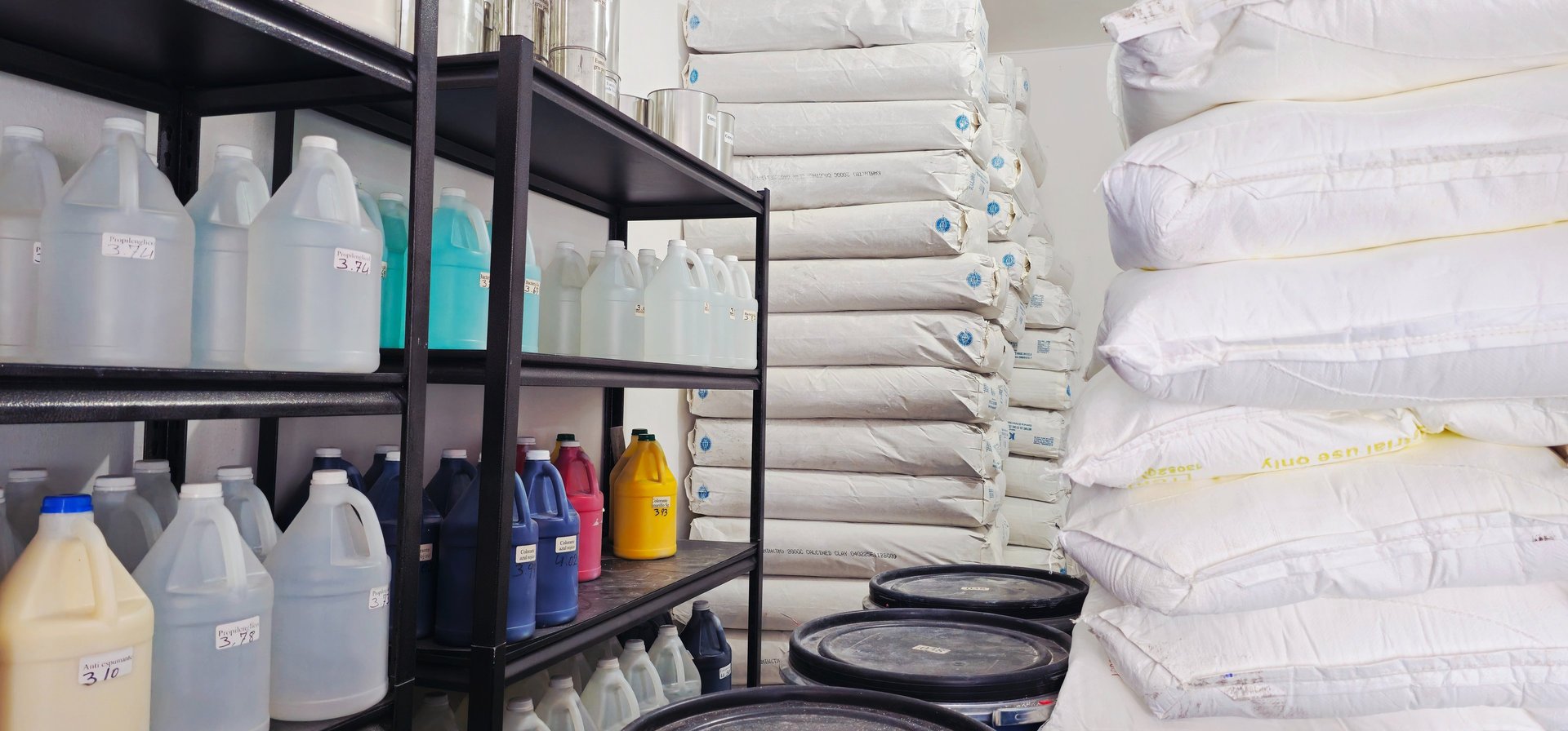 yellow and black plastic trash bins