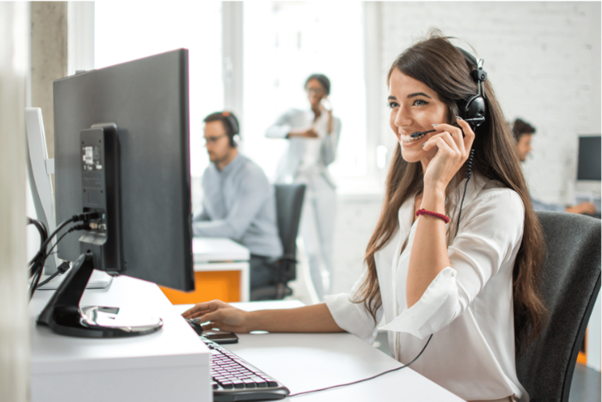 black and brown headset near laptop computer