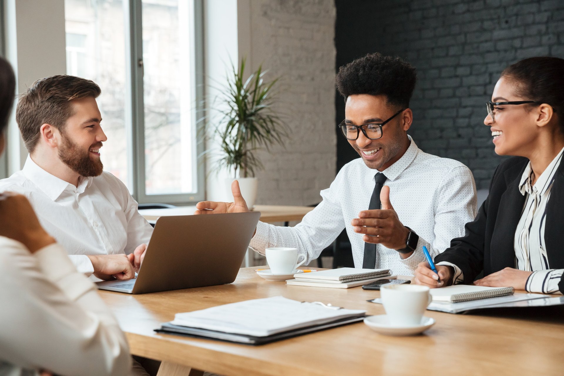 business-man-signing-documents-during-meeting-with-partner