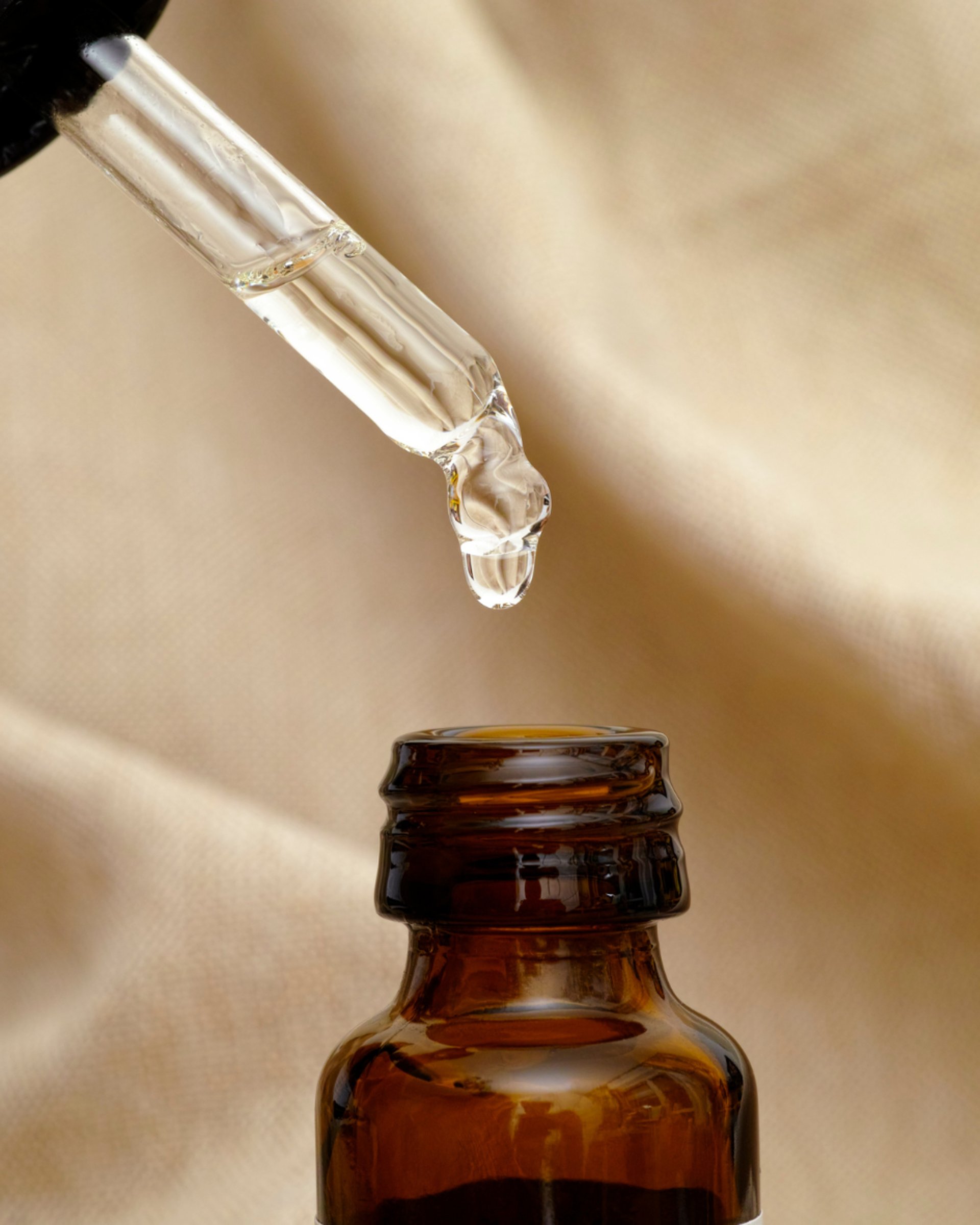 an abstract photo of a curved building with a blue sky in the background