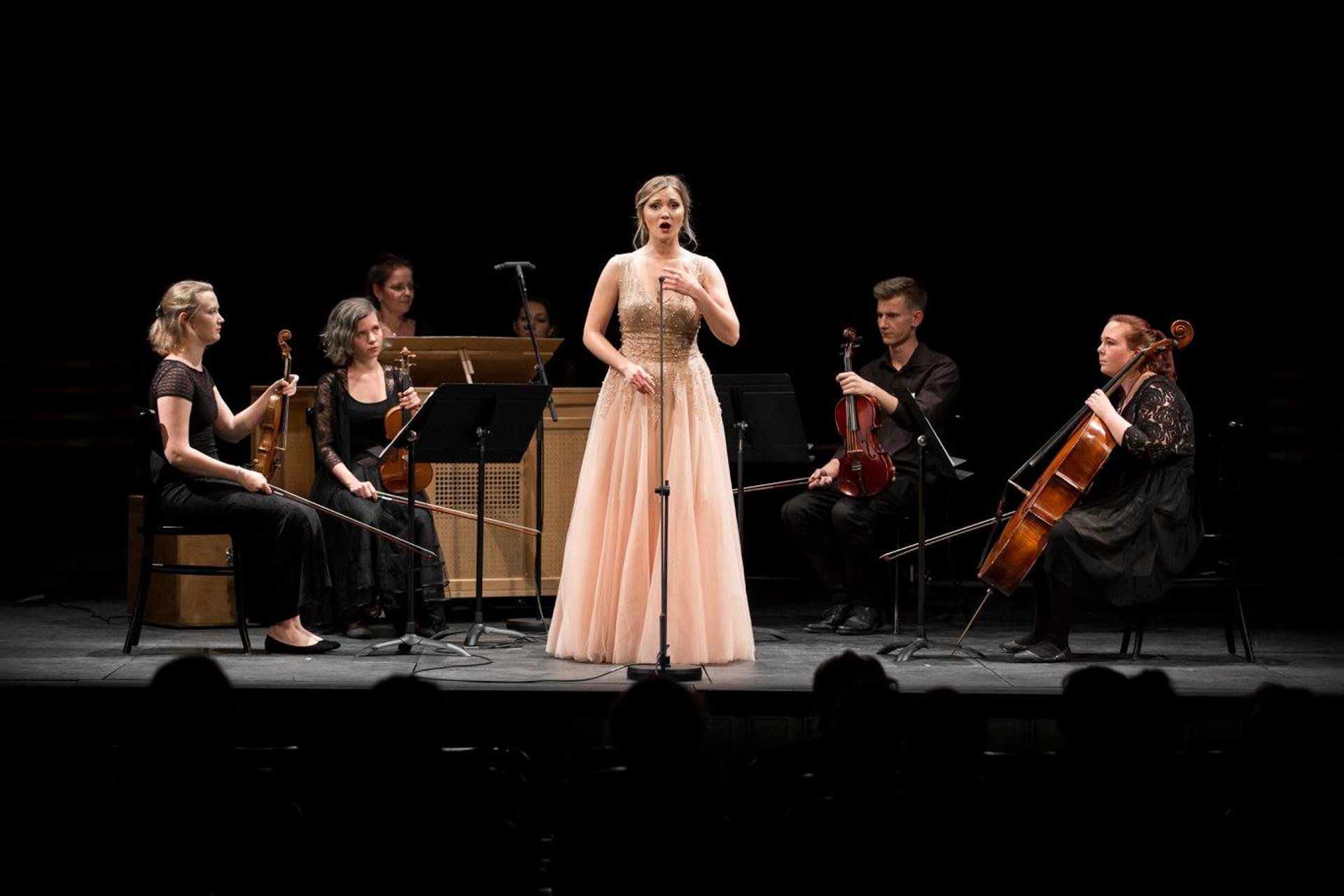 an abstract photo of a curved building with a blue sky in the background