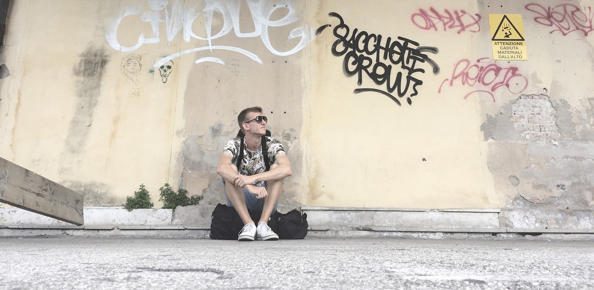 an abstract photo of a curved building with a blue sky in the background
