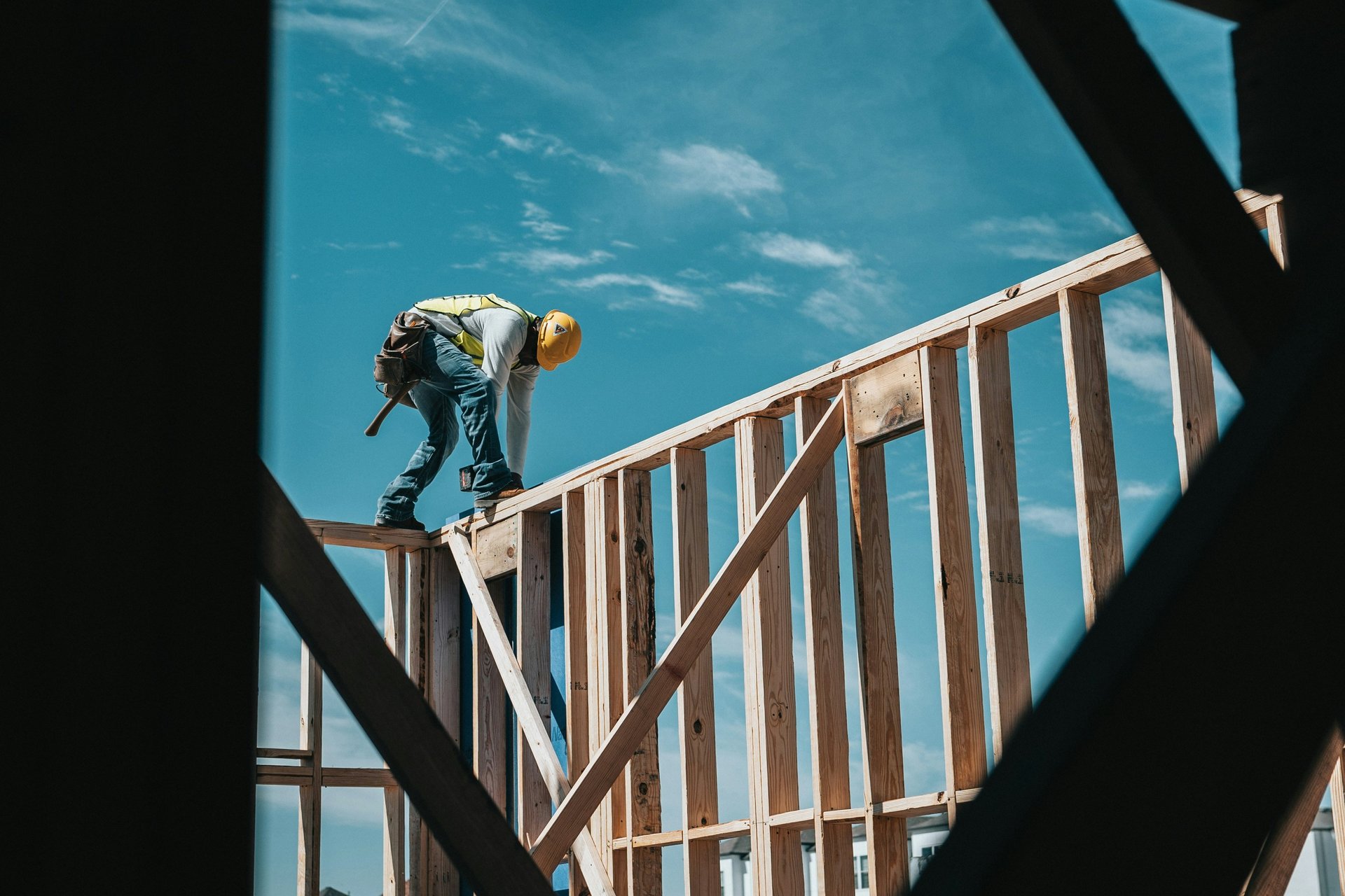 A builder stabilising the foundation of a house