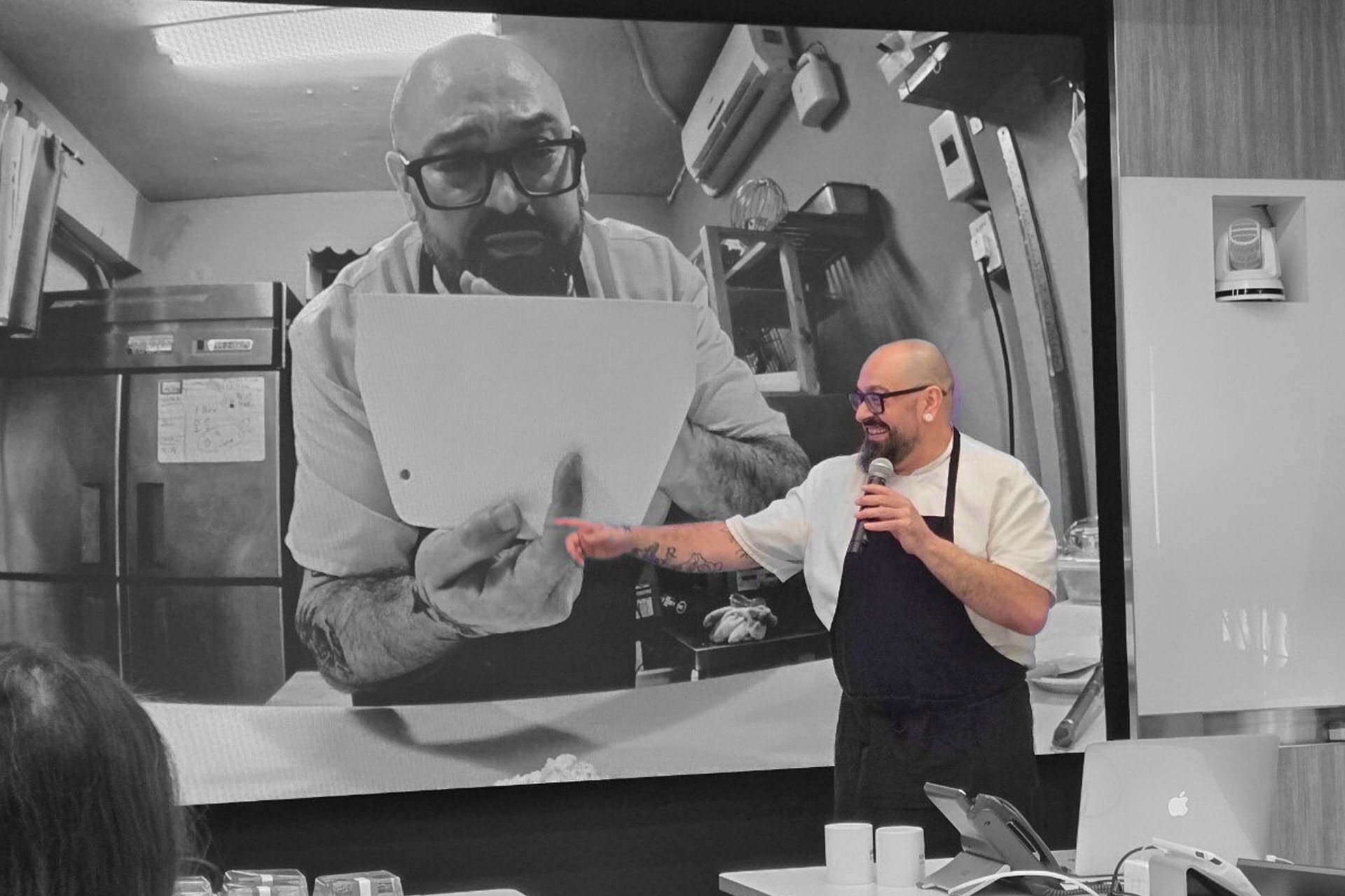 an abstract photo of a curved building with a blue sky in the background