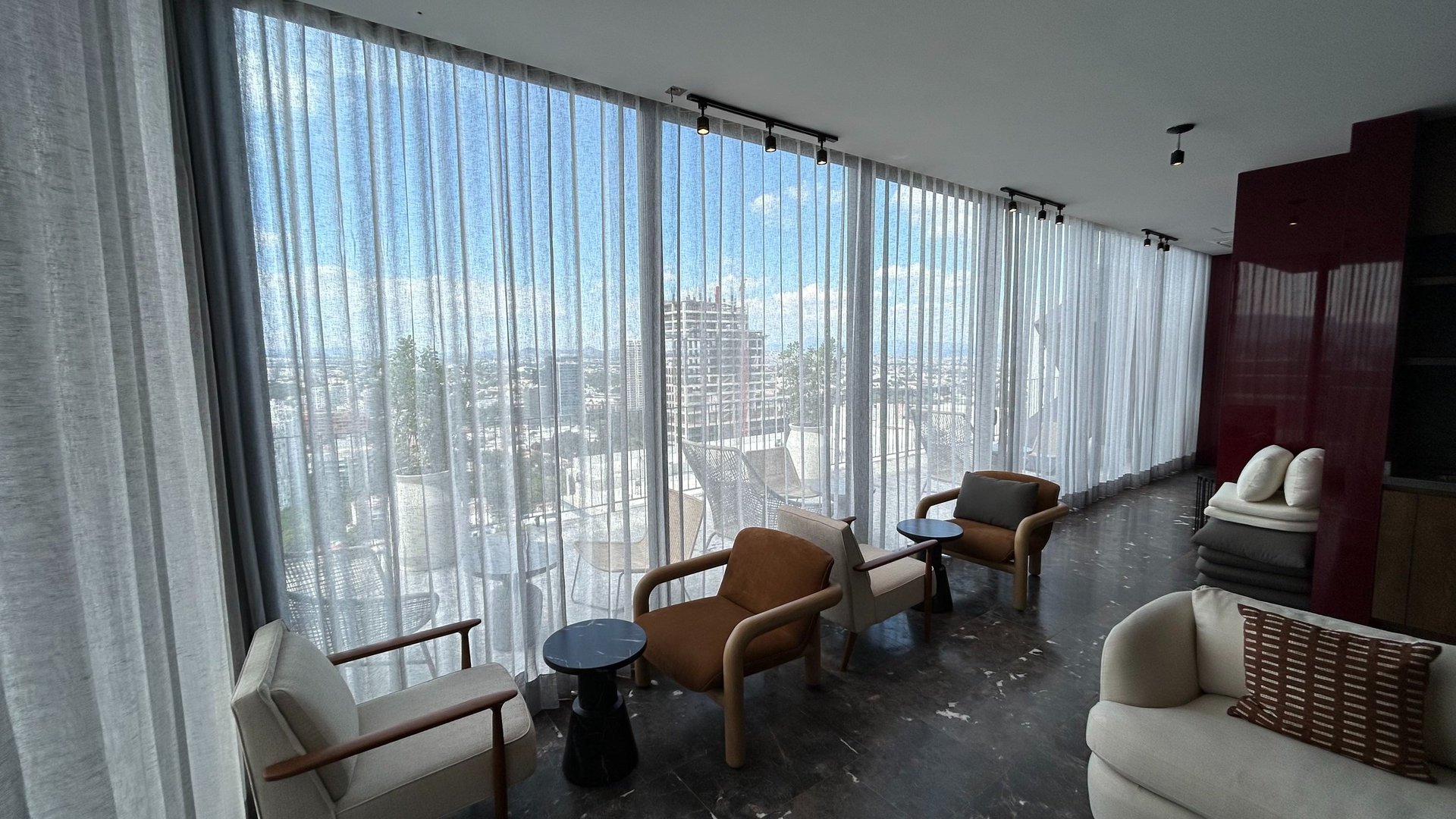 black and brown leather padded tub sofa