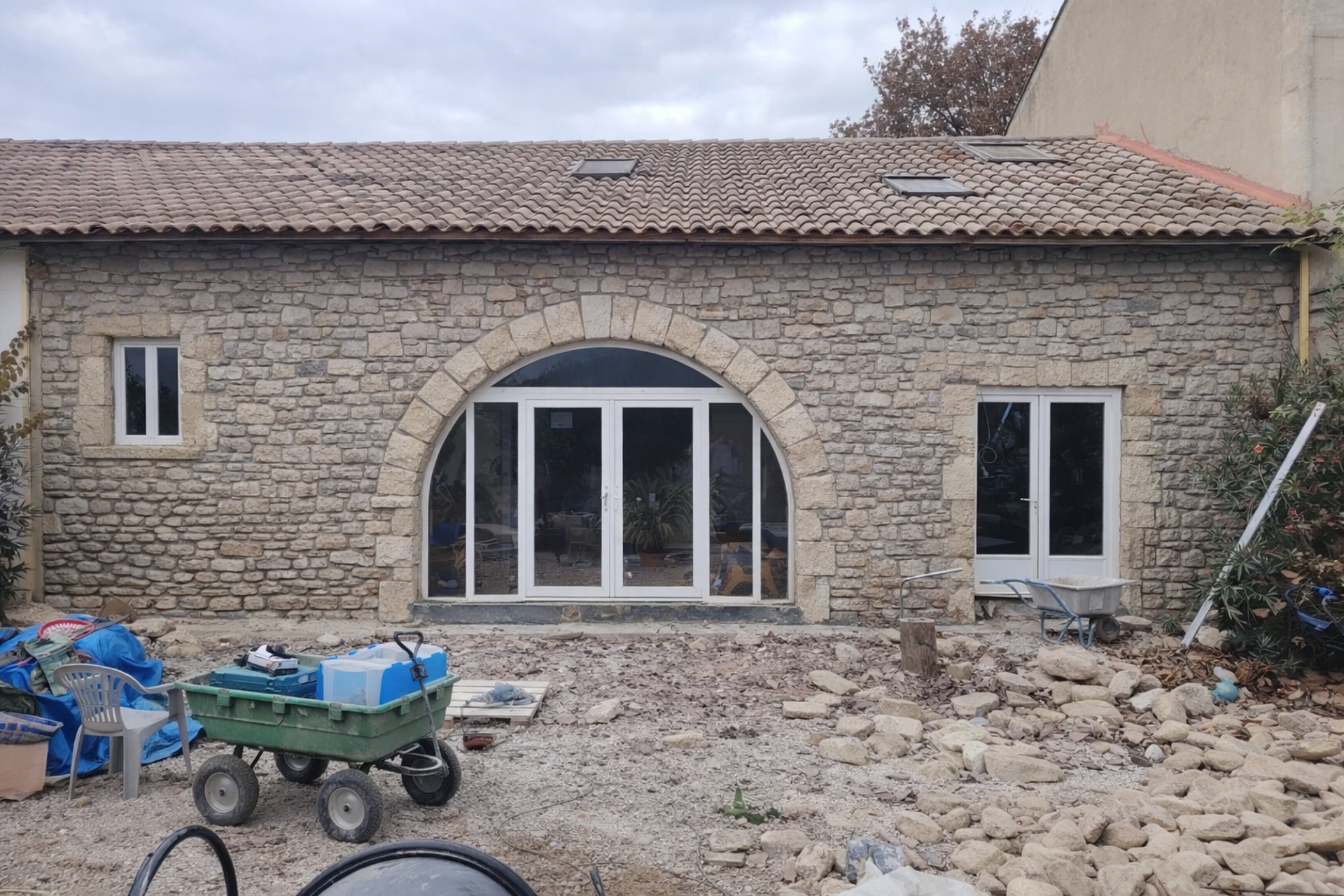 white wooden kitchen island and cupboard cabinets near glass panel door