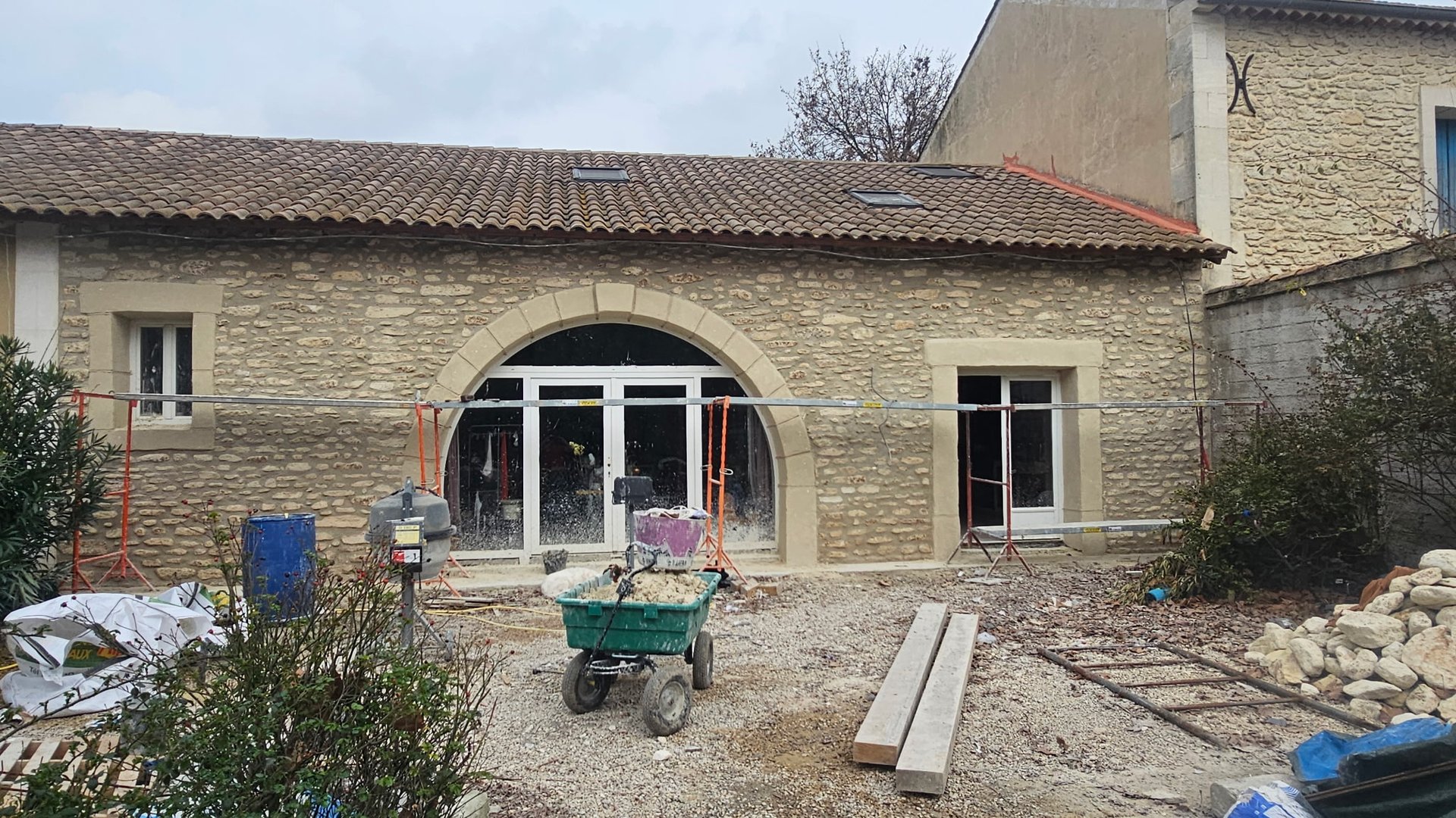 white wooden kitchen island and cupboard cabinets near glass panel door
