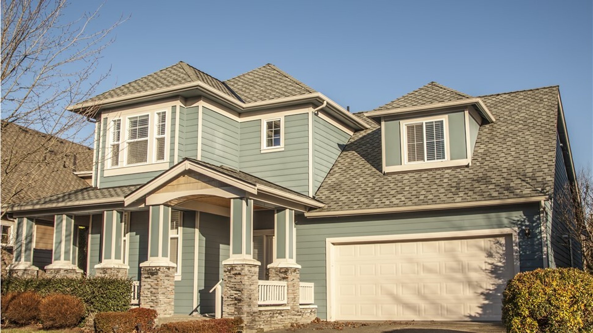 an abstract photo of a curved building with a blue sky in the background