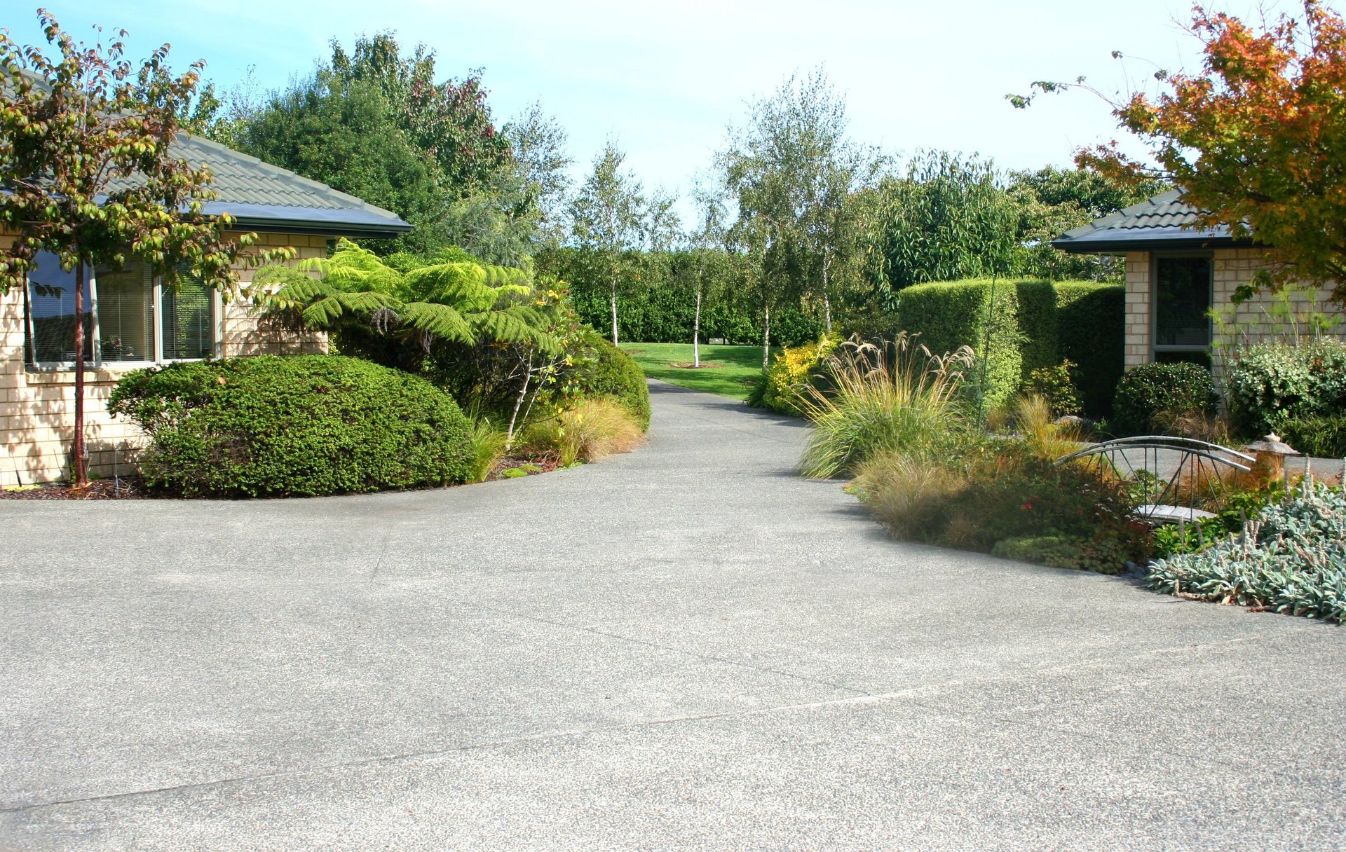 an abstract photo of a curved building with a blue sky in the background