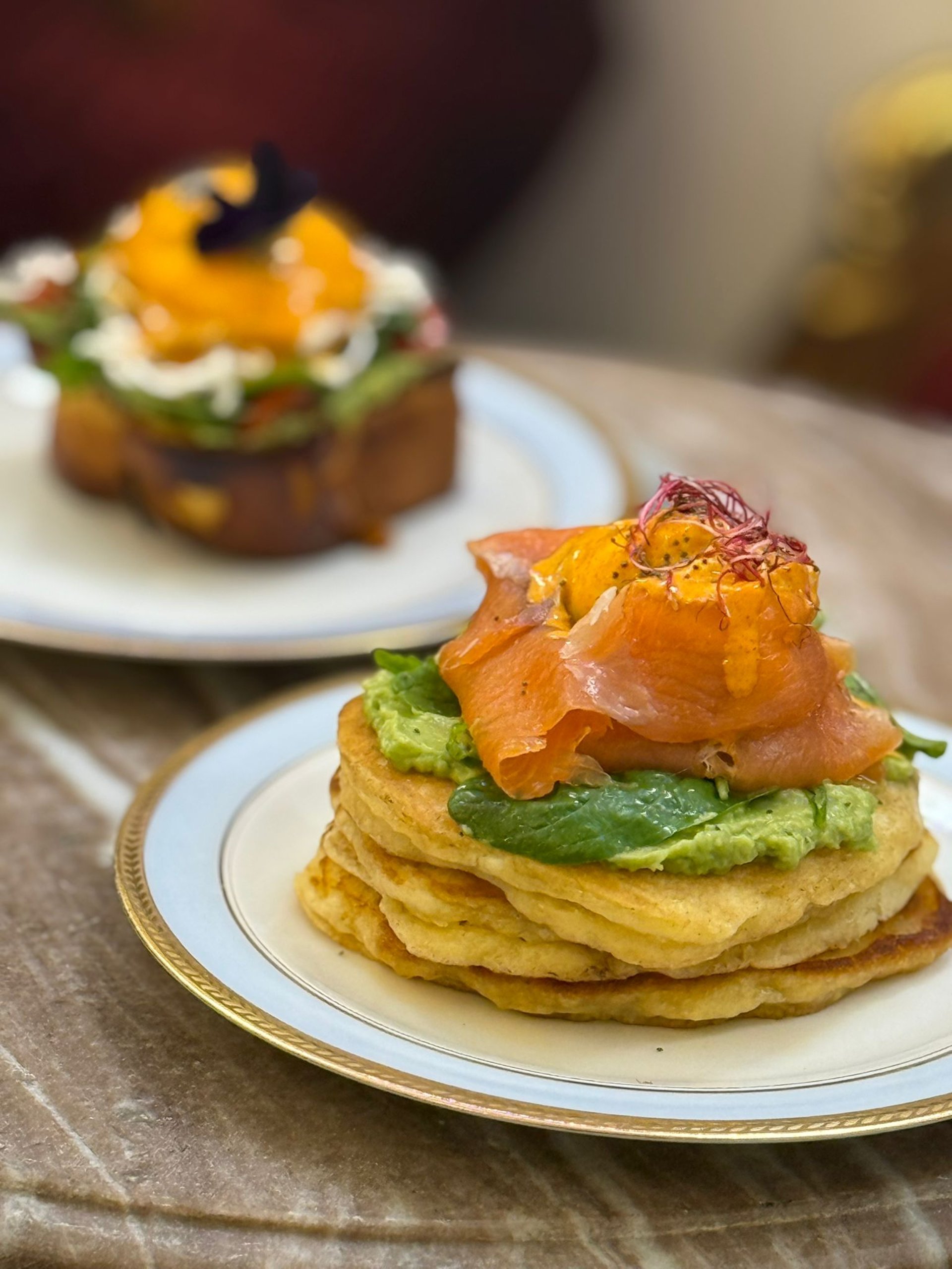 woman wearing yellow long-sleeved dress under white clouds and blue sky during daytime