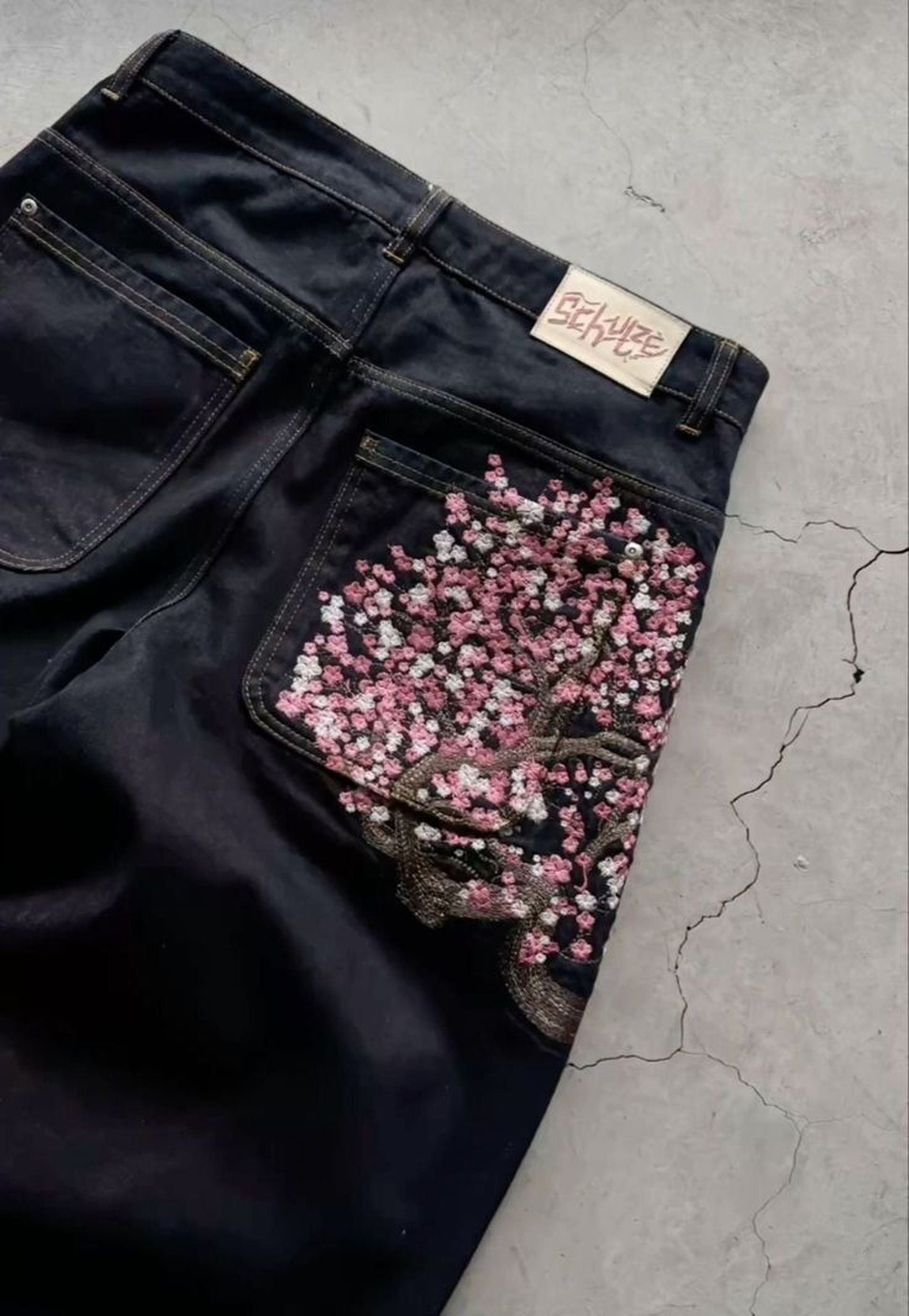 a stack of jeans sitting on top of each other