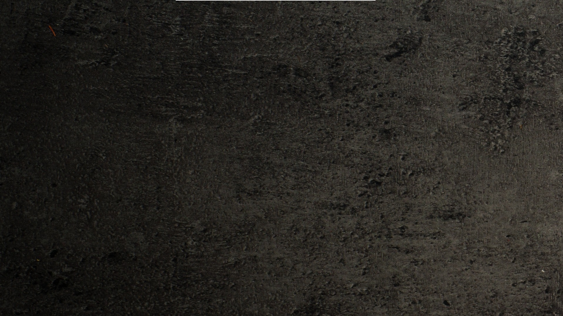a close up of a black and brown abstract painting