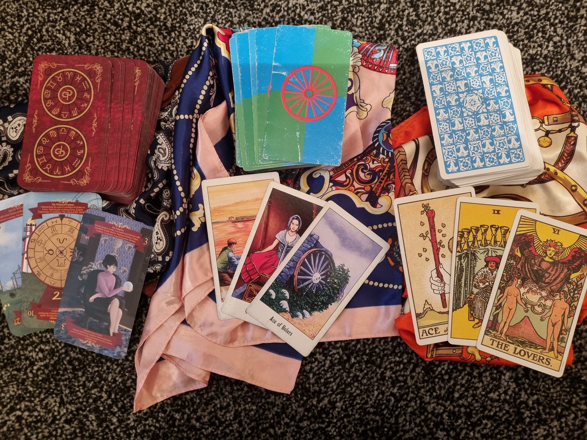 picture of 3 sets of tarot cards front and back