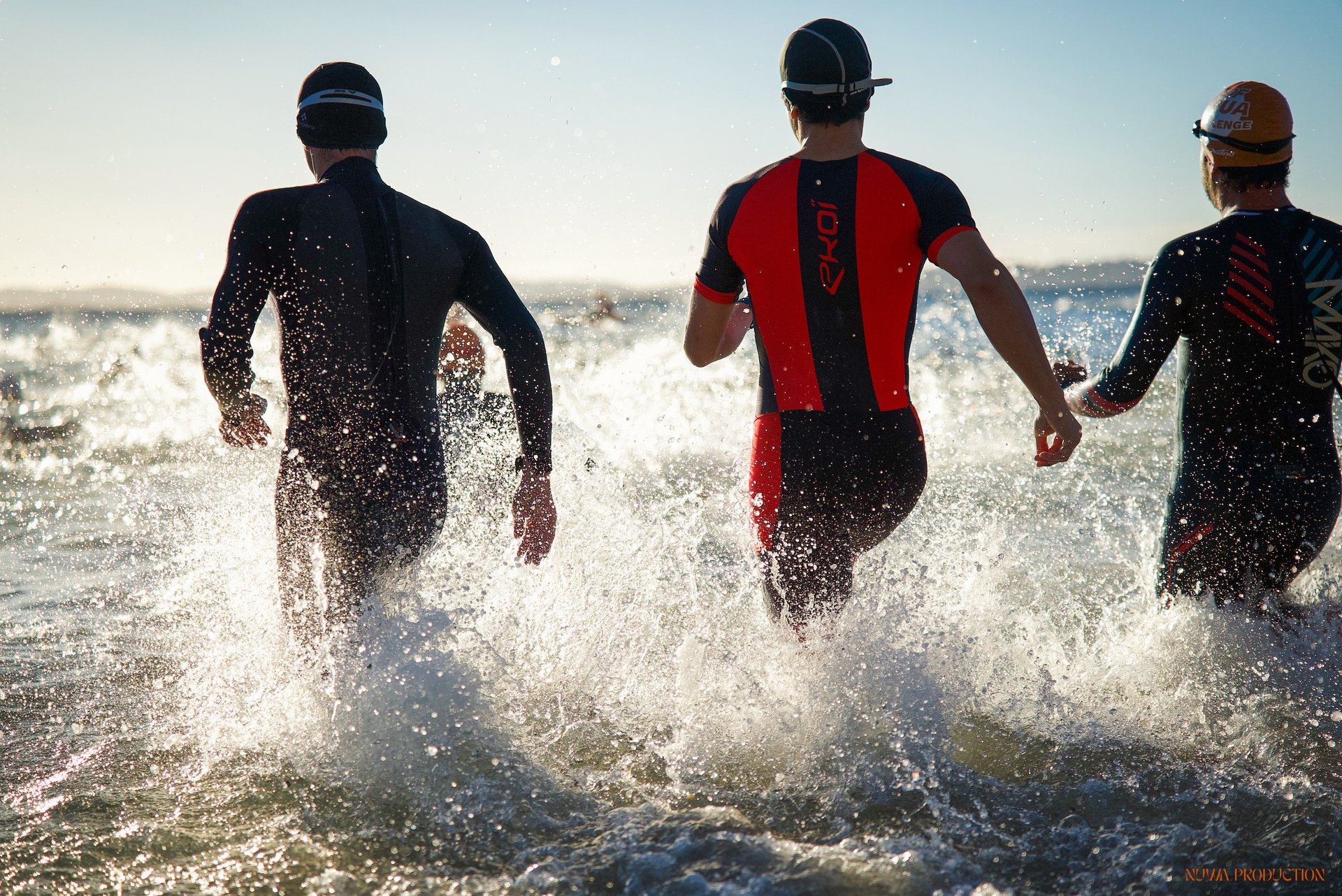 an abstract photo of a curved building with a blue sky in the background