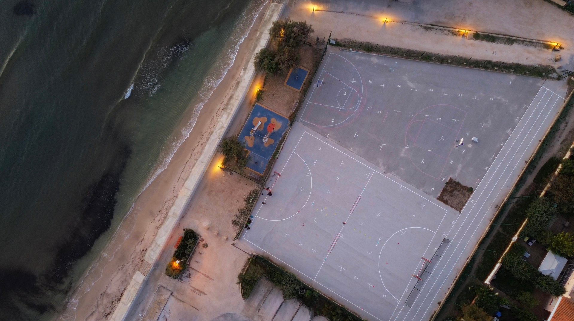 an abstract photo of a curved building with a blue sky in the background