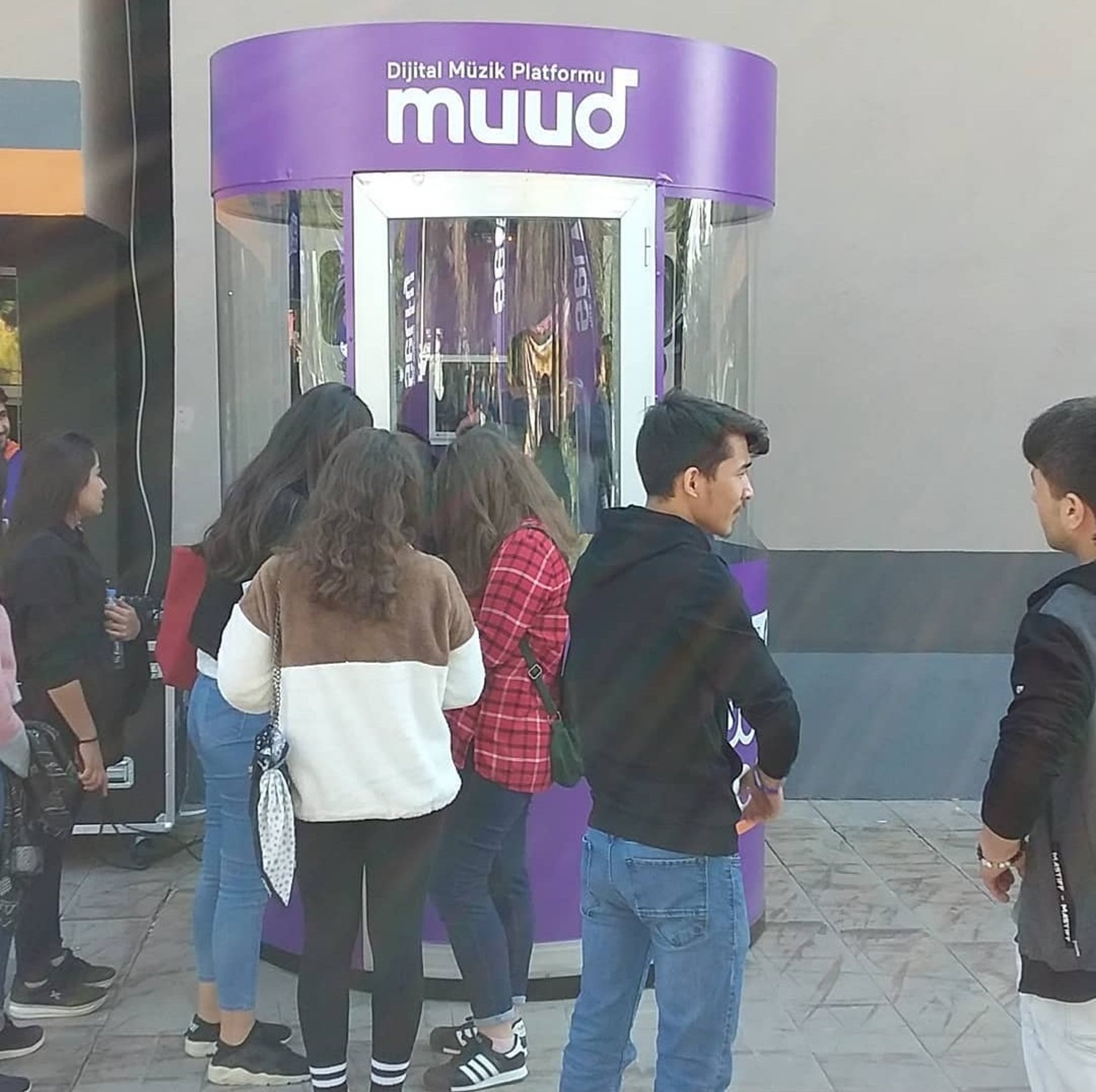 woman wearing yellow long-sleeved dress under white clouds and blue sky during daytime