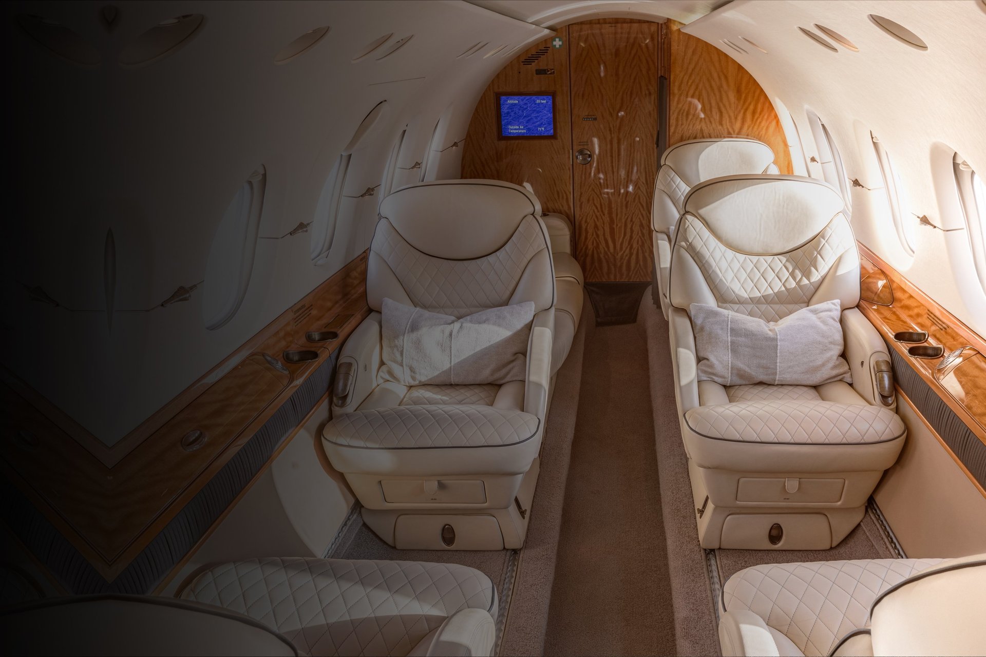 Hawker 800XP cabin interior with luxury leather seating and ambient lighting