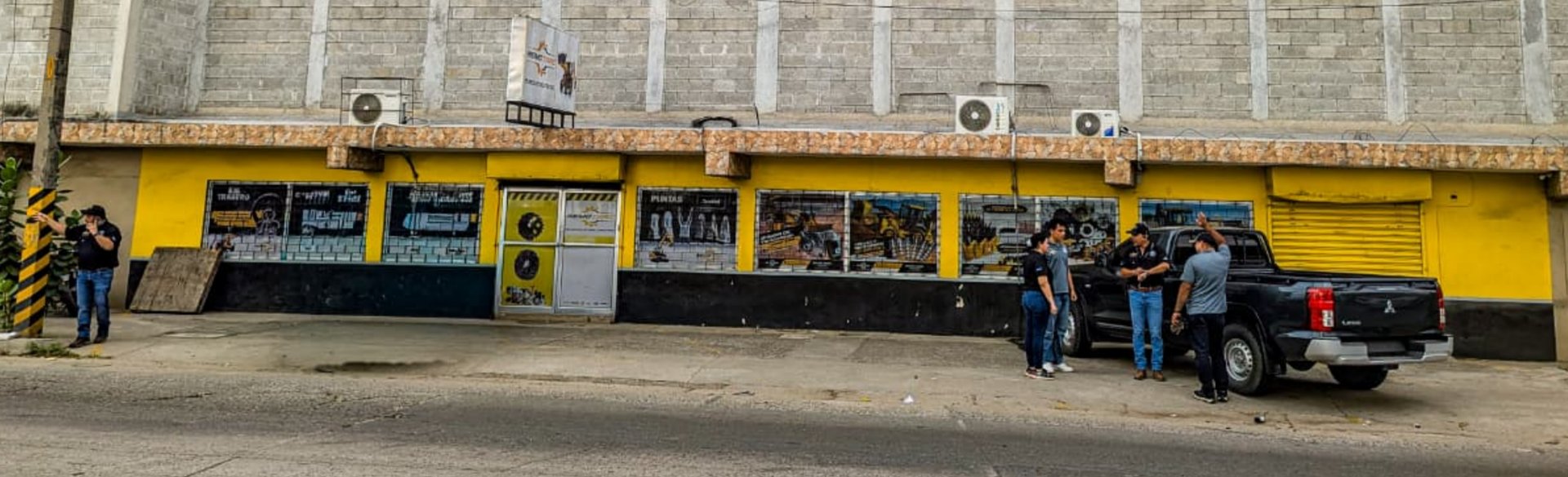 an abstract photo of a curved building with a blue sky in the background