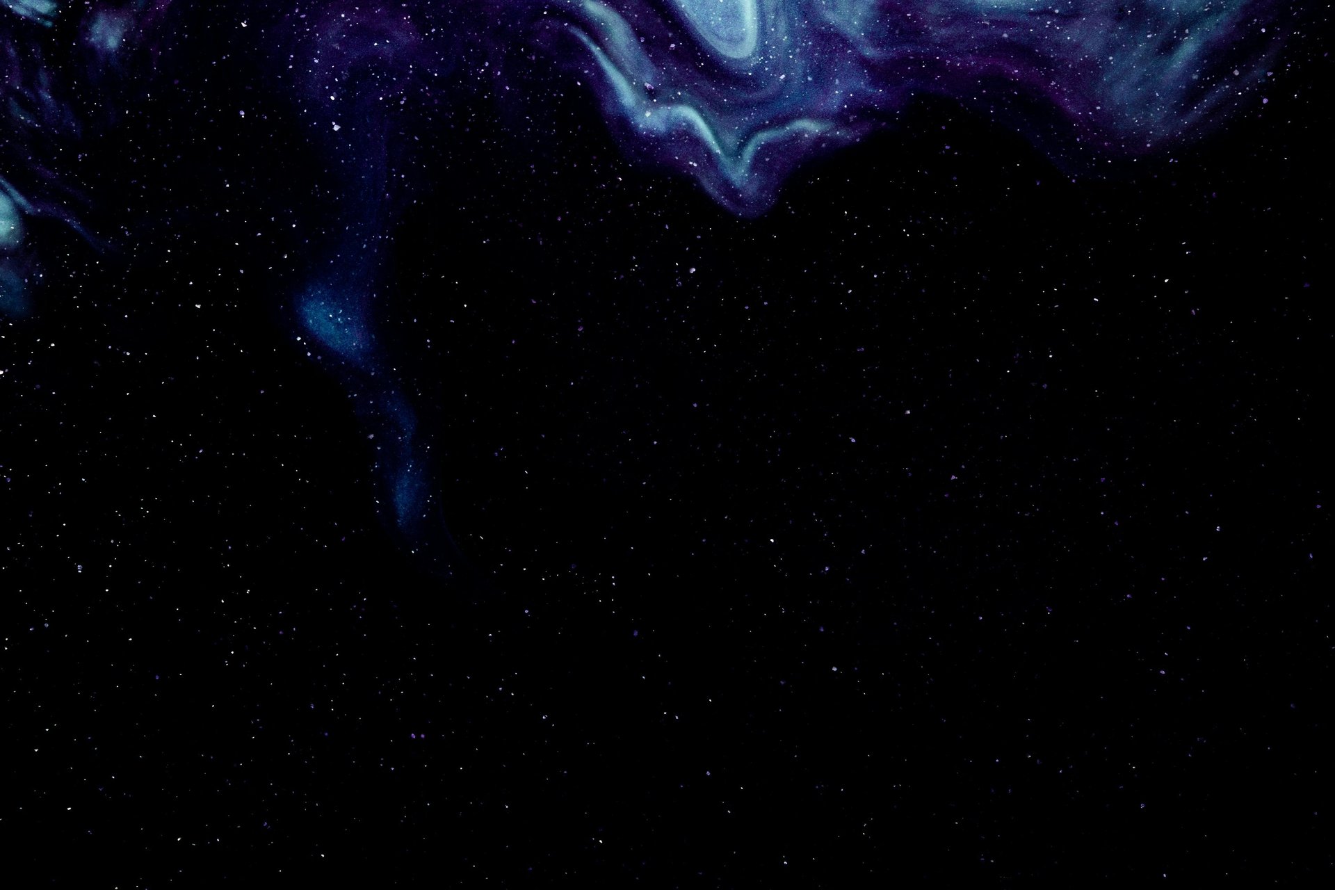 an abstract photo of a curved building with a blue sky in the background