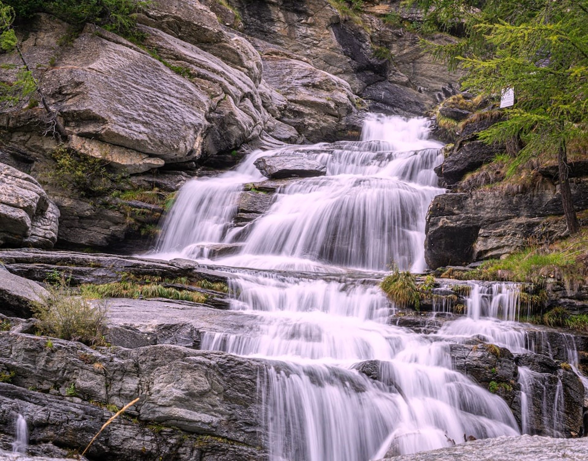 A small waterfall in the middle of a forest