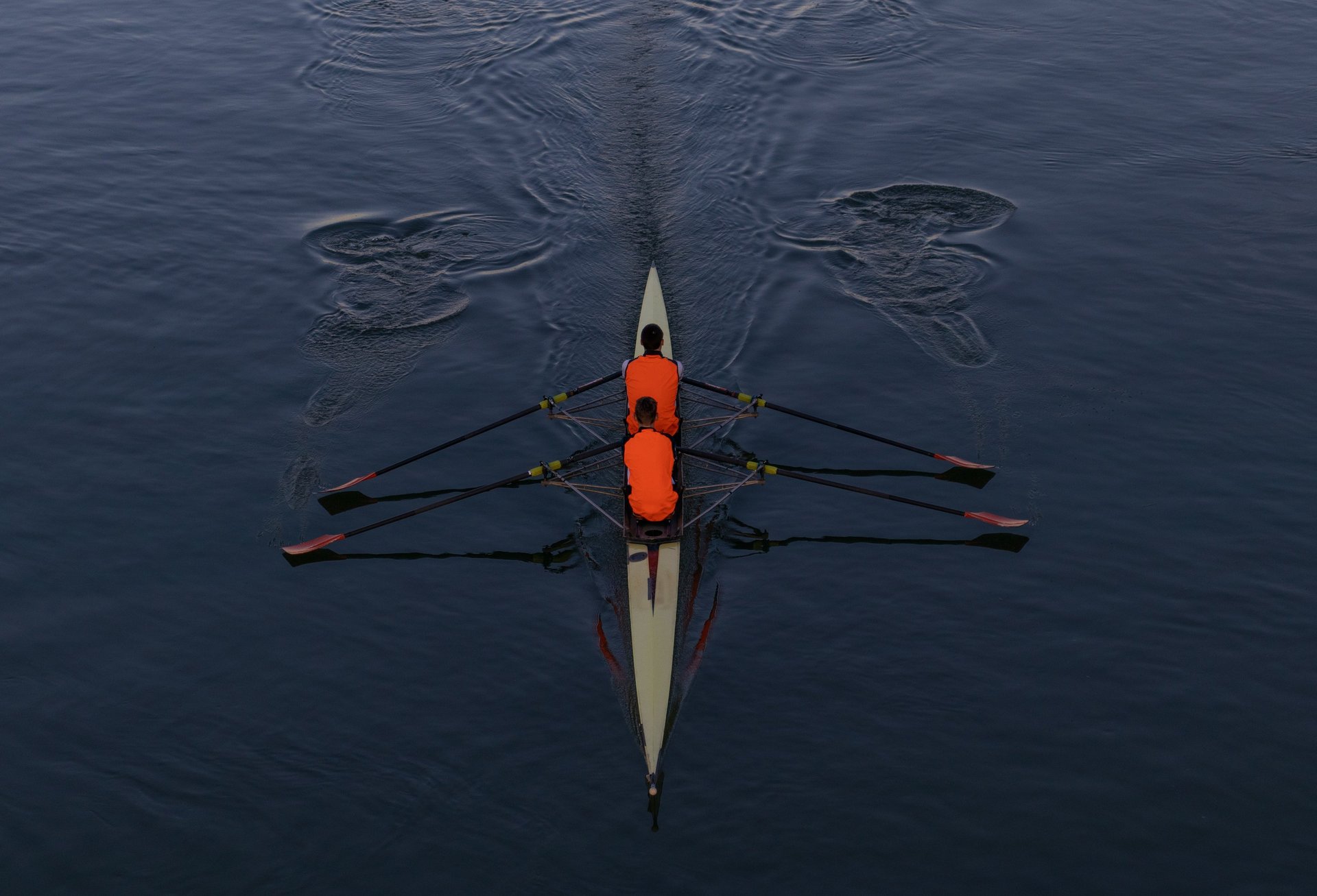 people riding boat on body of water