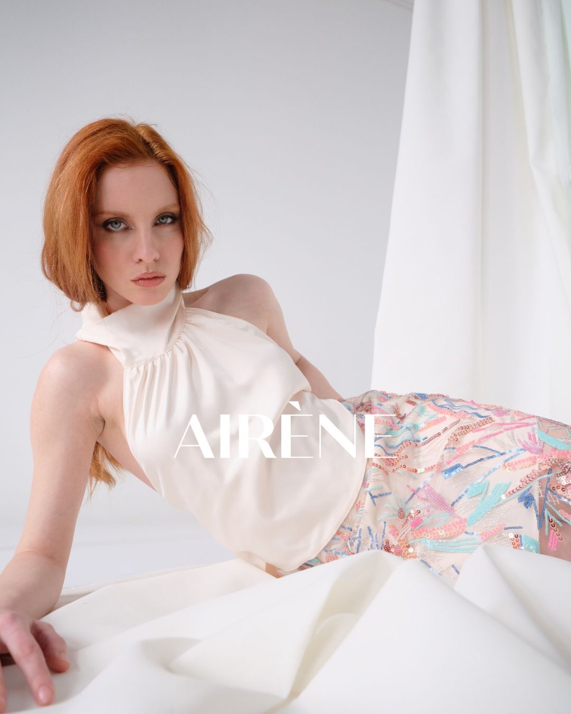 an abstract photo of a curved building with a blue sky in the background