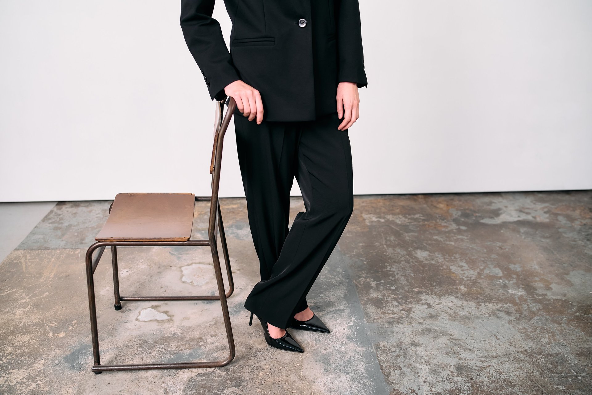 an abstract photo of a curved building with a blue sky in the background