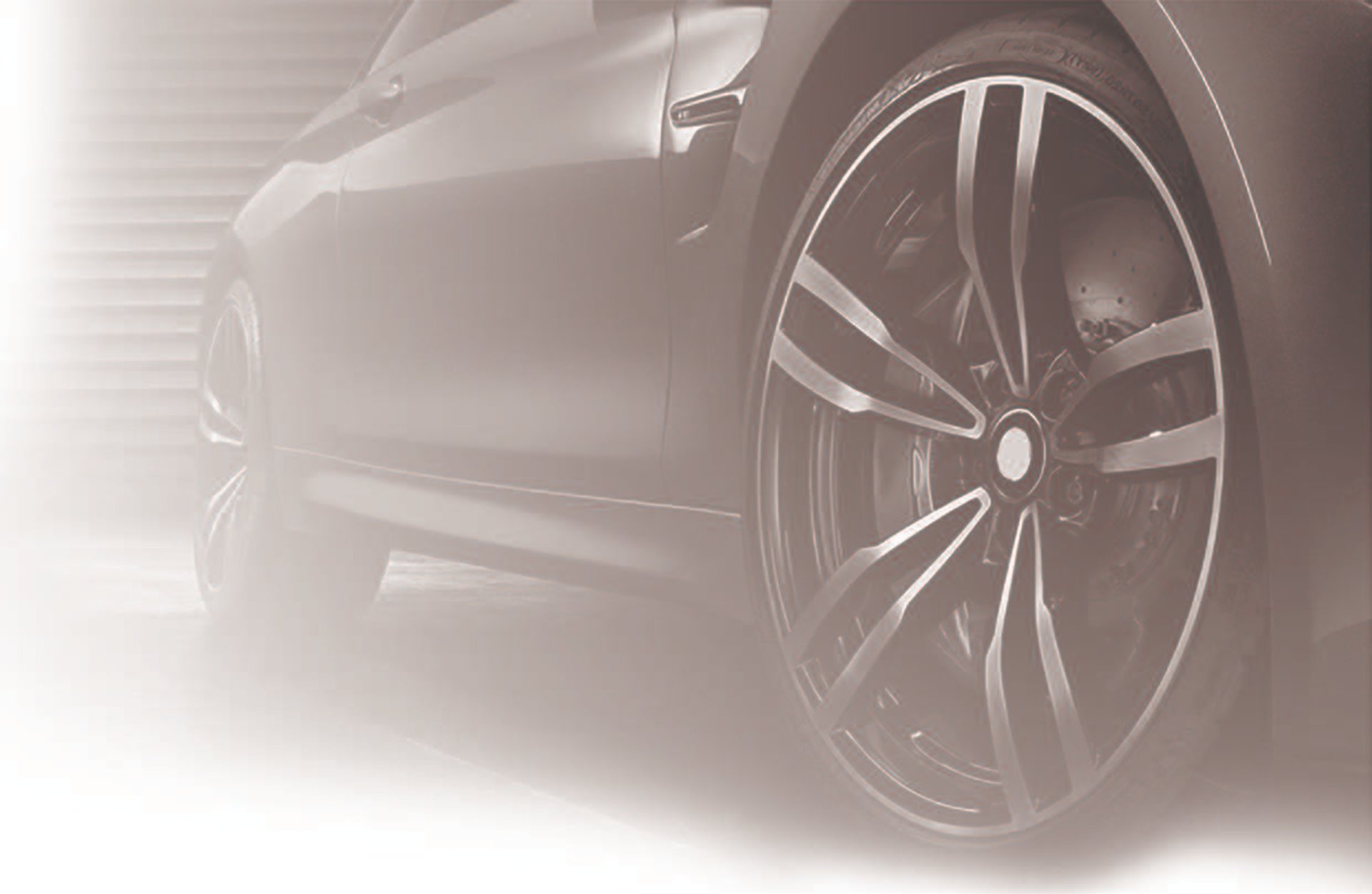 black BMW 5-spoke vehicle wheel with tire