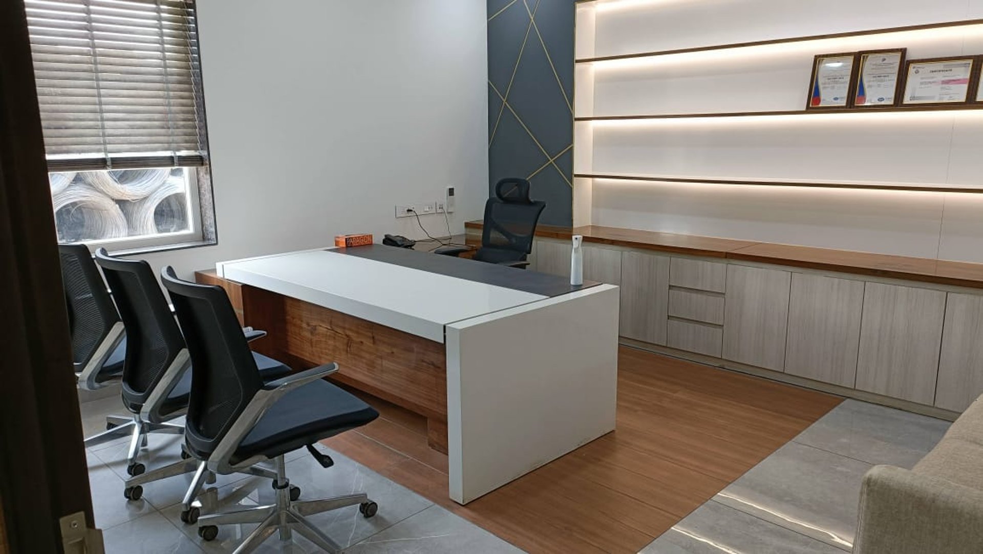 an abstract photo of a curved building with a blue sky in the background