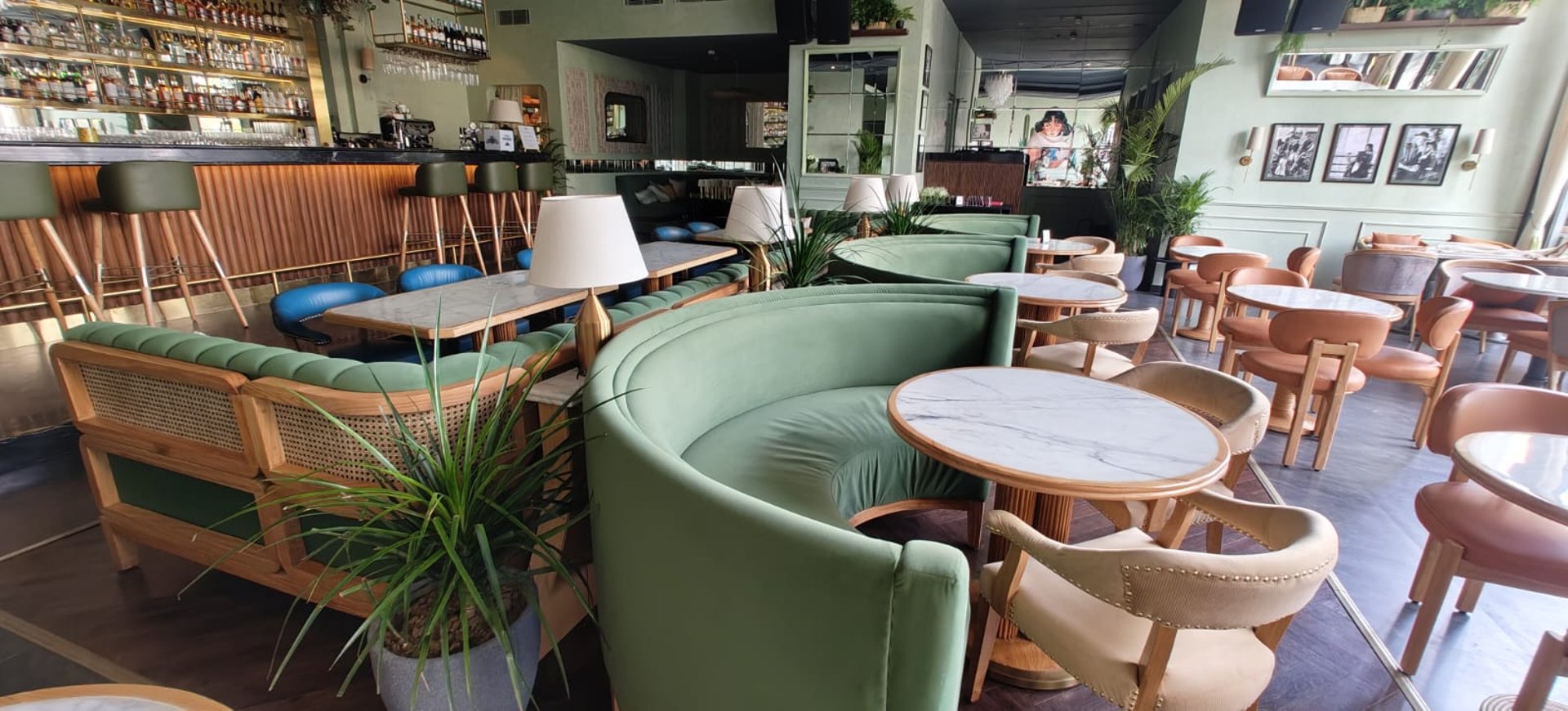oval brown wooden conference table and chairs inside conference room