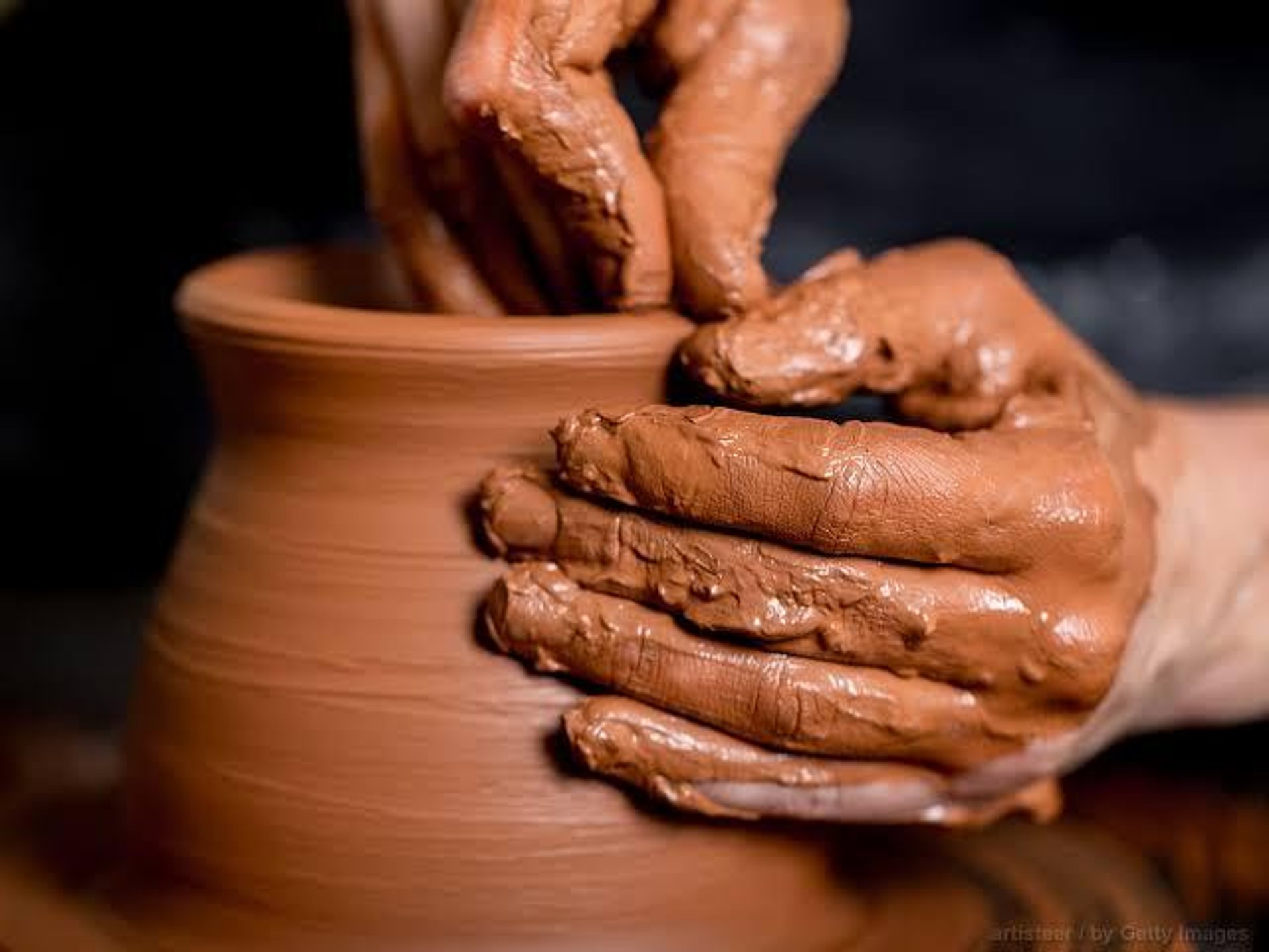 a close up of two people holding hands