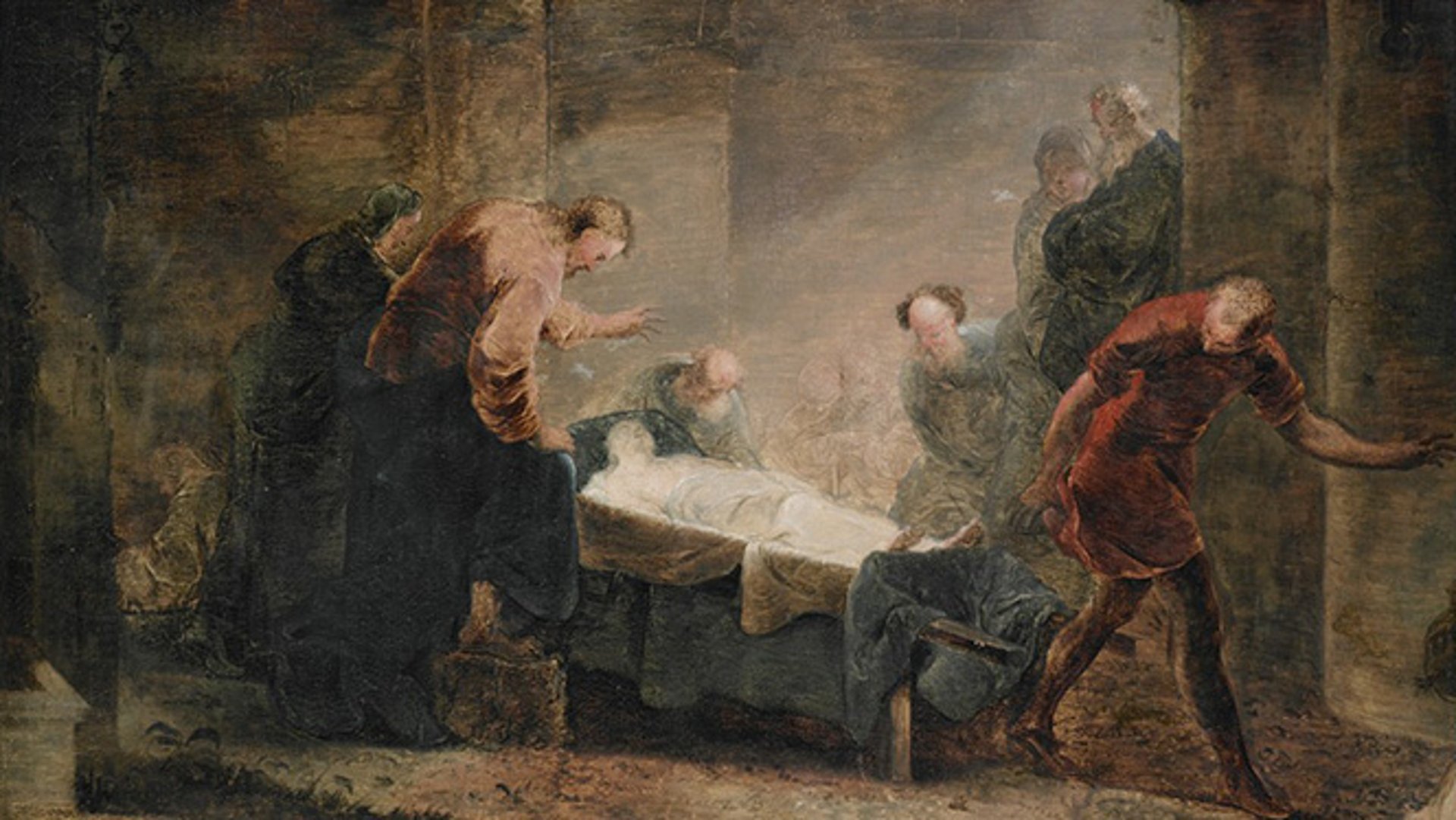 photograph of person facing opposite in smoky spotlight