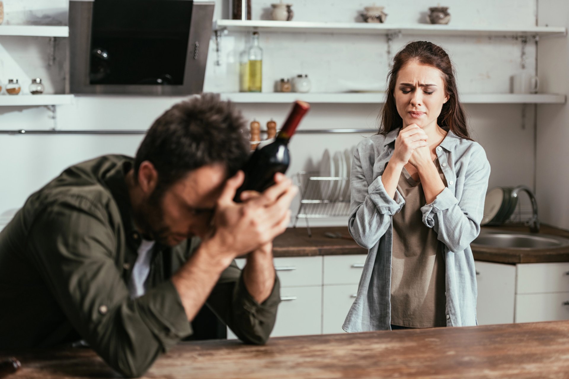 three people staring at the crucifix